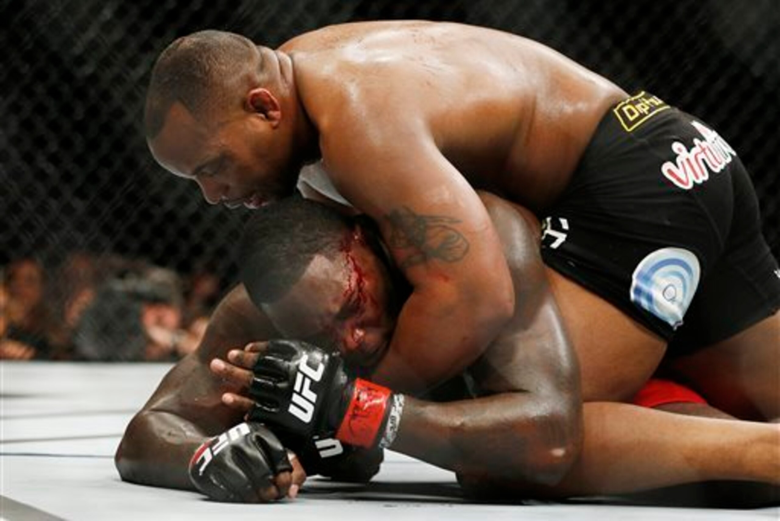 Cormier floored the bleeding Johnson. Cormier floored the bleeding Johnson.