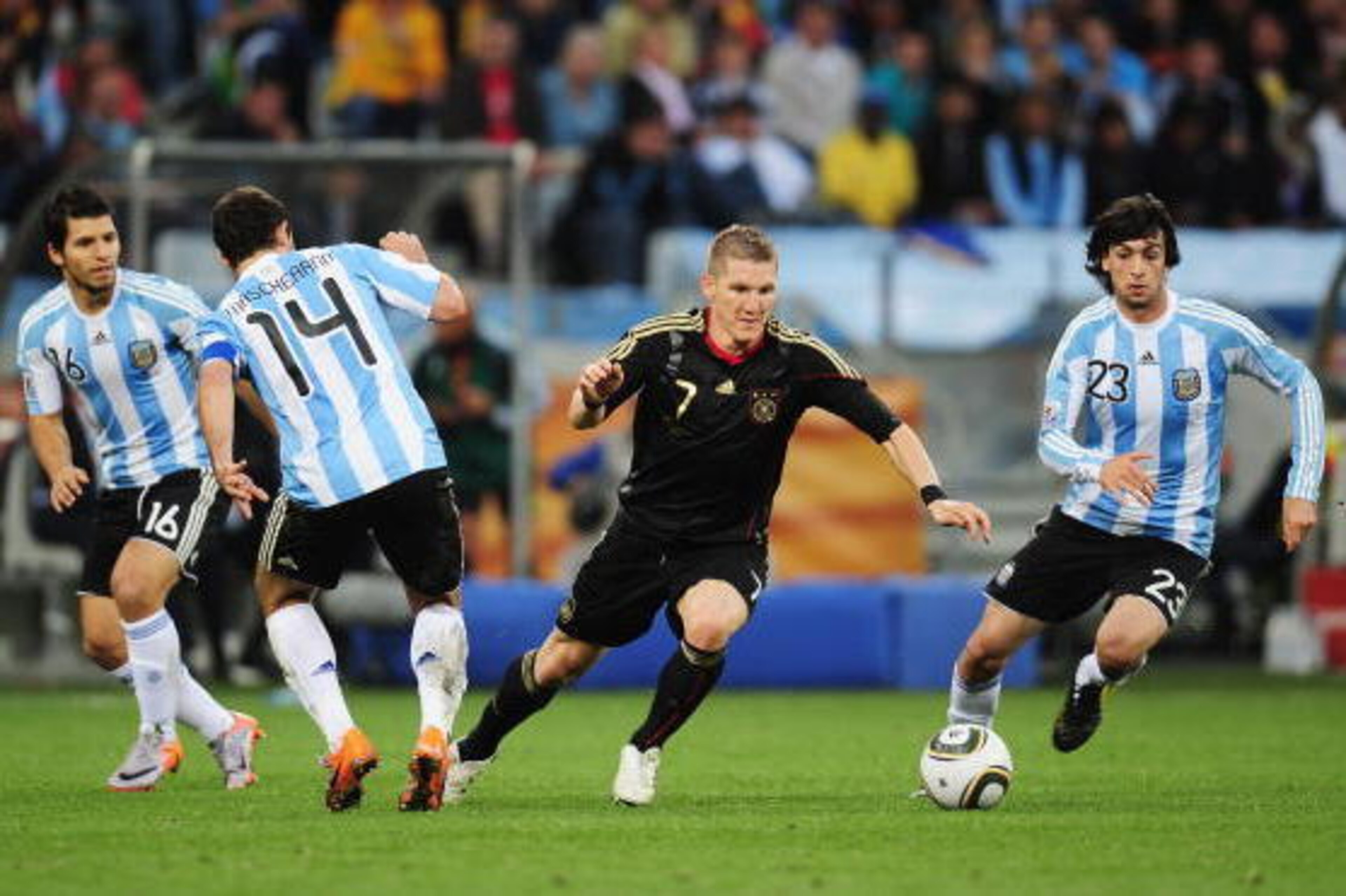CAPE TOWN, SOUTH AFRICA - JULY 03: Bastian Schweinsteiger of Germany is challenged by Sergio Aguero, Javier Mascherano and Javier Pastore during the 2010 FIFA World Cup South Africa Quarter Final match between Argentina and Germany at Green Point Stadium CAPE TOWN, SOUTH AFRICA - JULY 03: Bastian Schweinsteiger of Germany is challenged by Sergio Aguero, Javier Mascherano and Javier Pastore during the 2010 FIFA World Cup South Africa Quarter Final match between Argentina and Germany at Green Point Stadium