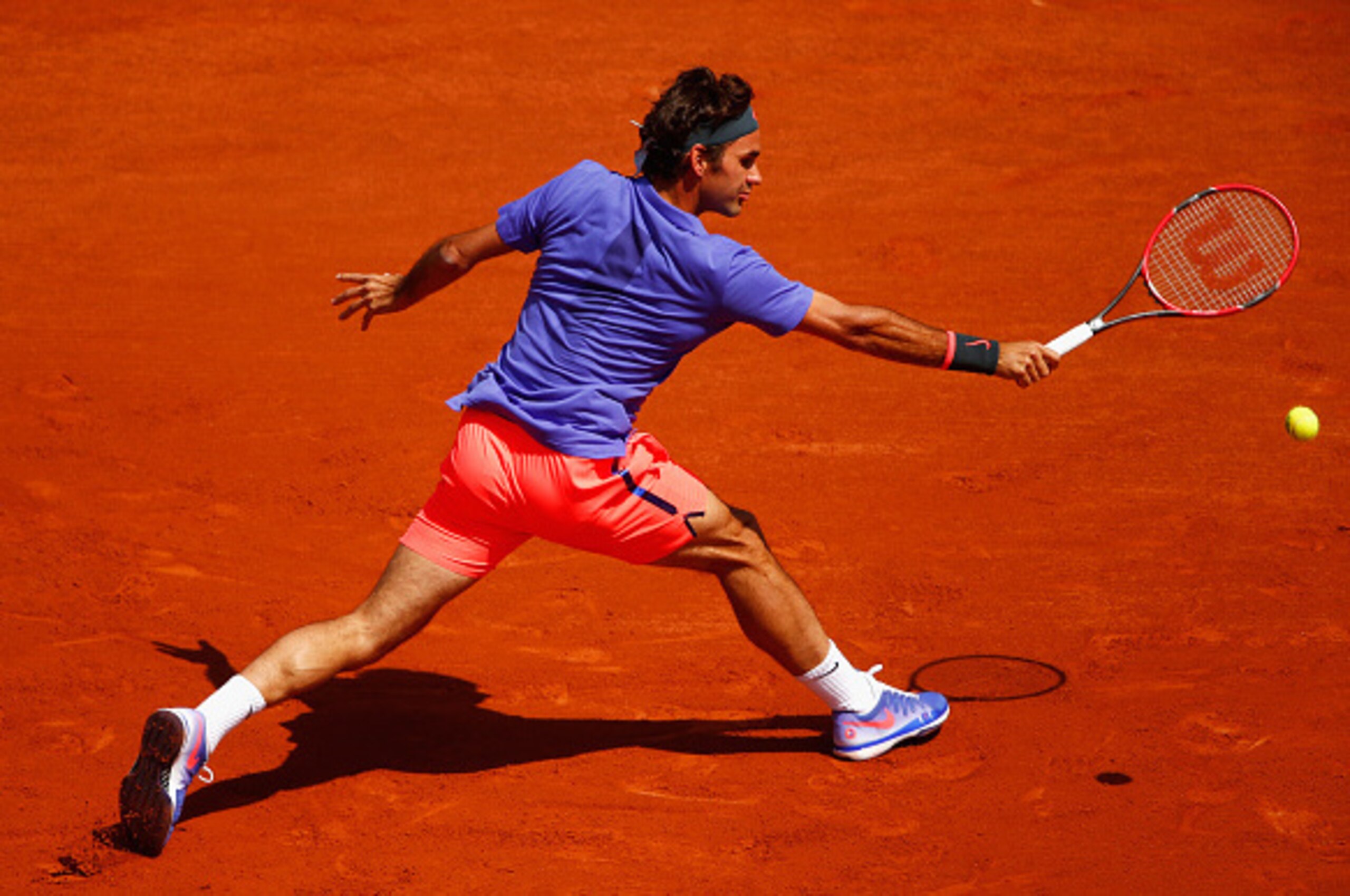 PARIS, FRANCE - MAY 24:  Roger Federer of Switzerland plays a backhand during his Men's Singles match against Alejandro Falla of Colombia on day one of the 2015 French Open at Roland Garros on May 24, 2015 in Paris, France.  (Photo by Julian Finney/Getty 