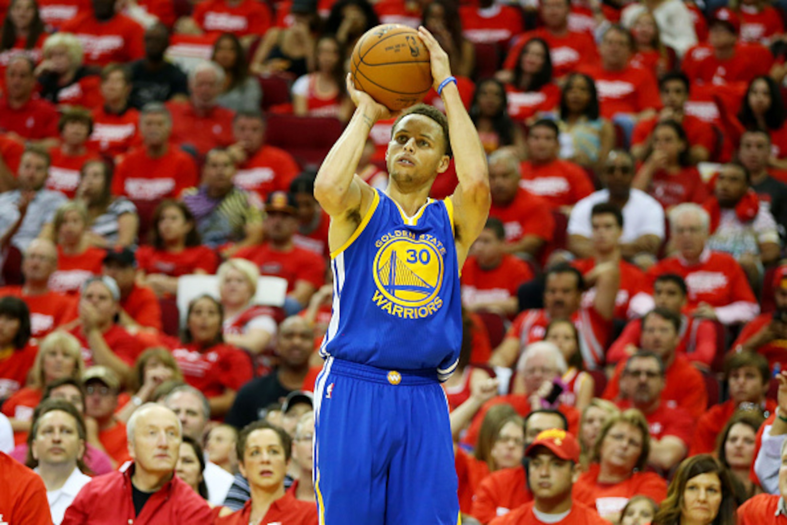HOUSTON, TX - MAY 23:  Stephen Curry #30 of the Golden State Warriors shoots a three pointer in the third quarter against the Houston Rockets during Game Three of the Western Conference Finals of the 2015 NBA PLayoffs at Toyota Center on May 23, 2015 in H