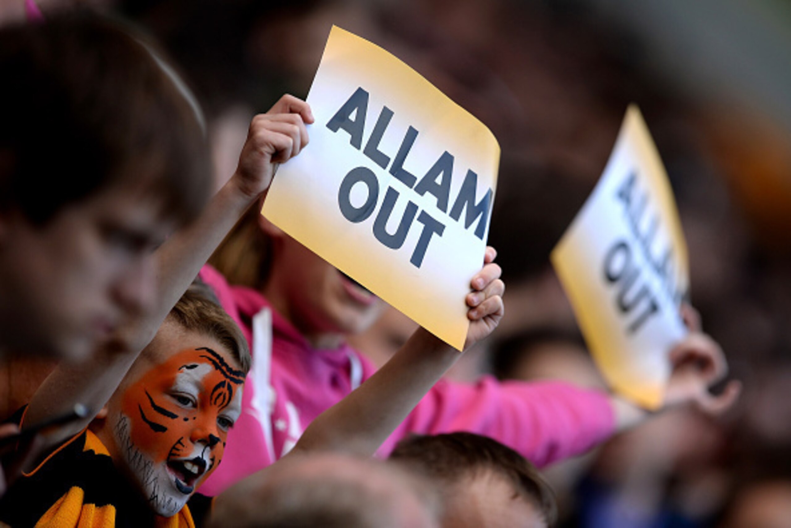 HULL, ENGLAND - MAY 24:  Hull City supporters hold banners to criticize owner Assem Allam during the Premier League after the Barclays Premier League match between Hull City and Manchester United at KC Stadium on May 24, 2015 in Hull, England.  (Photo by 