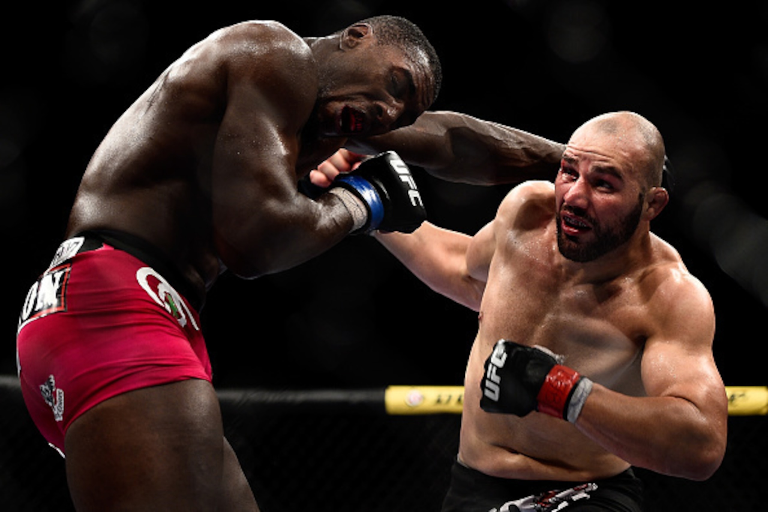 RIO DE JANEIRO, BRAZIL - OCTOBER 25:  Phil Davis of the United States punches Glover Teixeira of Brazil in their light heavyweight bout during the UFC 179 event at Maracanazinho on October 25, 2014 in Rio de Janeiro, Brazil.  (Photo by Buda Mendes/Getty I