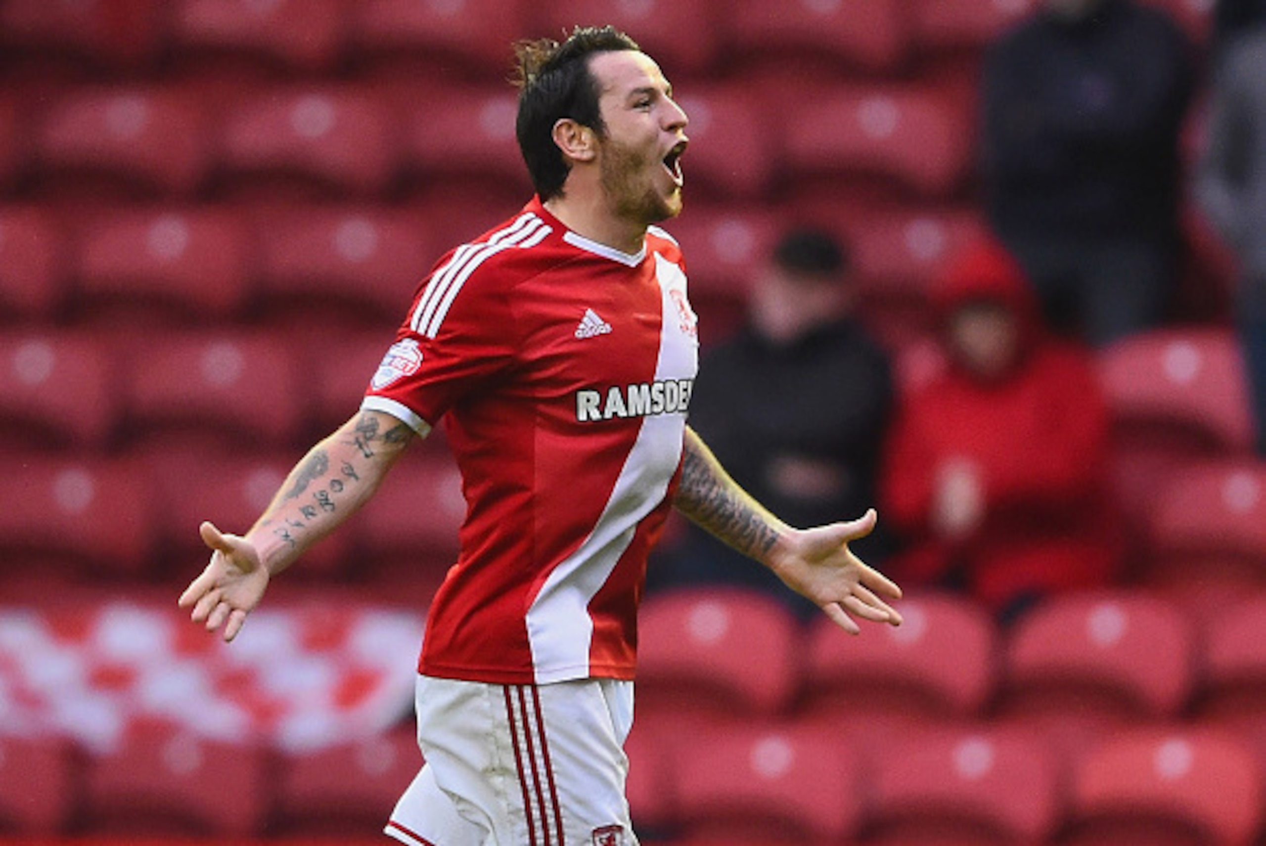 MIDDLESBROUGH, ENGLAND - MAY 15:  Lee Tomlin of Middlesbrough celebrates as he scores their first goal during the Sky Bet Championship Playoff semi final second leg match between Middlesbrough and Brentford at the Riverside Stadium on May 15, 2015 in Midd