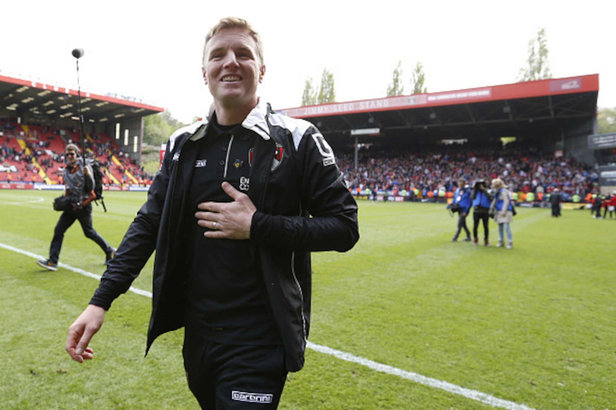 LONDON, ENGLAND - MAY 02: Eddie Howe, manager of Bournemouth celebrates on the pitch after winning the Championship during the Sky Bet Championship match between Charlton Athletic and AFC Bournemouth at The Valley on May 2, 2015 in London, England. (Photo