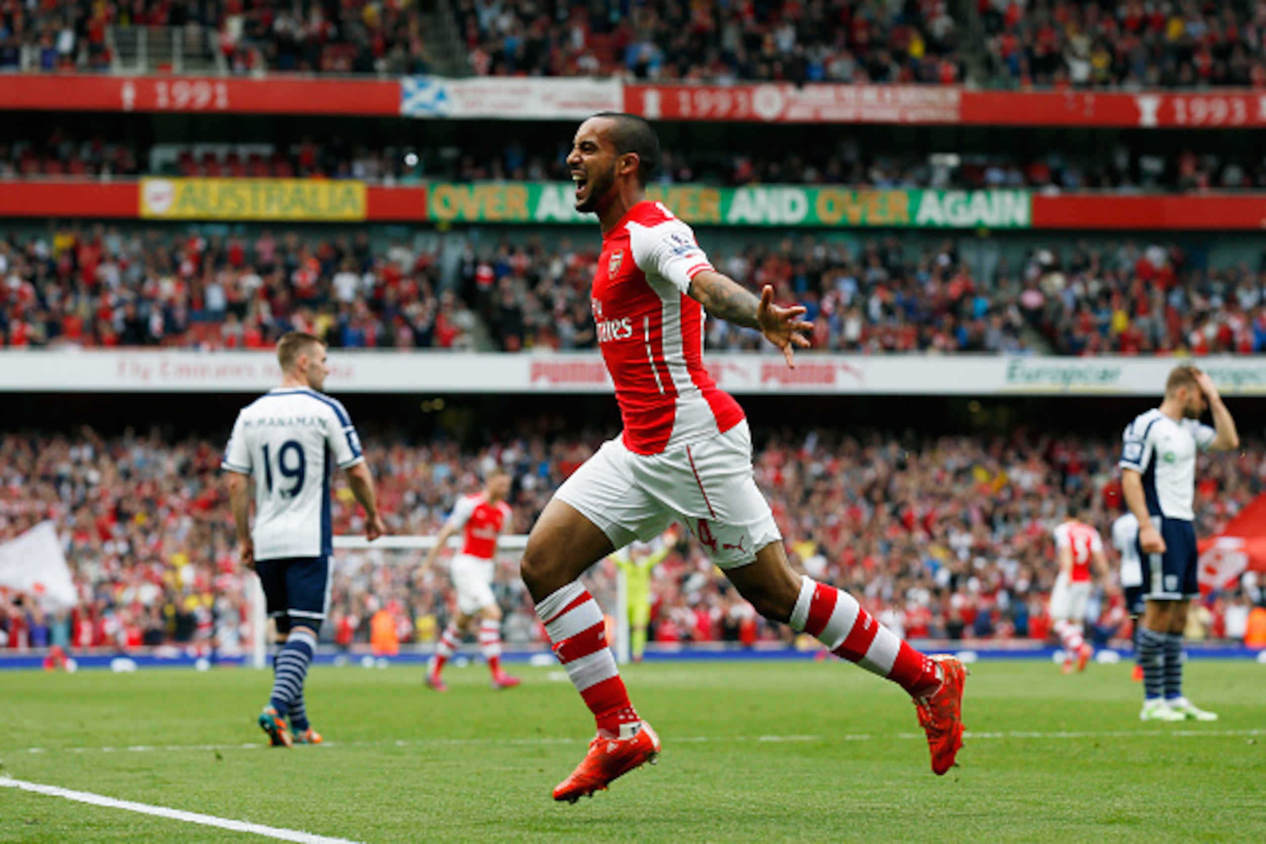 LONDON, ENGLAND - MAY 24:  Theo Walcott (2nd L, obsured) of Arsenal celebrates scoring his team's second goal during the Barclays Premier League match between Arsenal and West Bromwich Albion at Emirates Stadium on May 24, 2015 in London, England.  (Photo