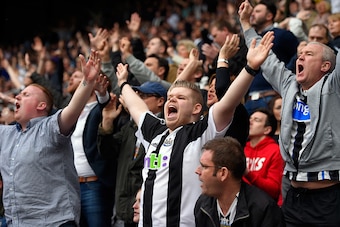 NEWCASTLE UPON TYNE, ENGLAND - MAY 24:   Newcastle fans celebrate victory during the Barclays Premier League match between Newcastle United and West Ham United at St James' Park on May 24, 2015 in Newcastle upon Tyne, England.  (Photo by Stu Forster/Getty
