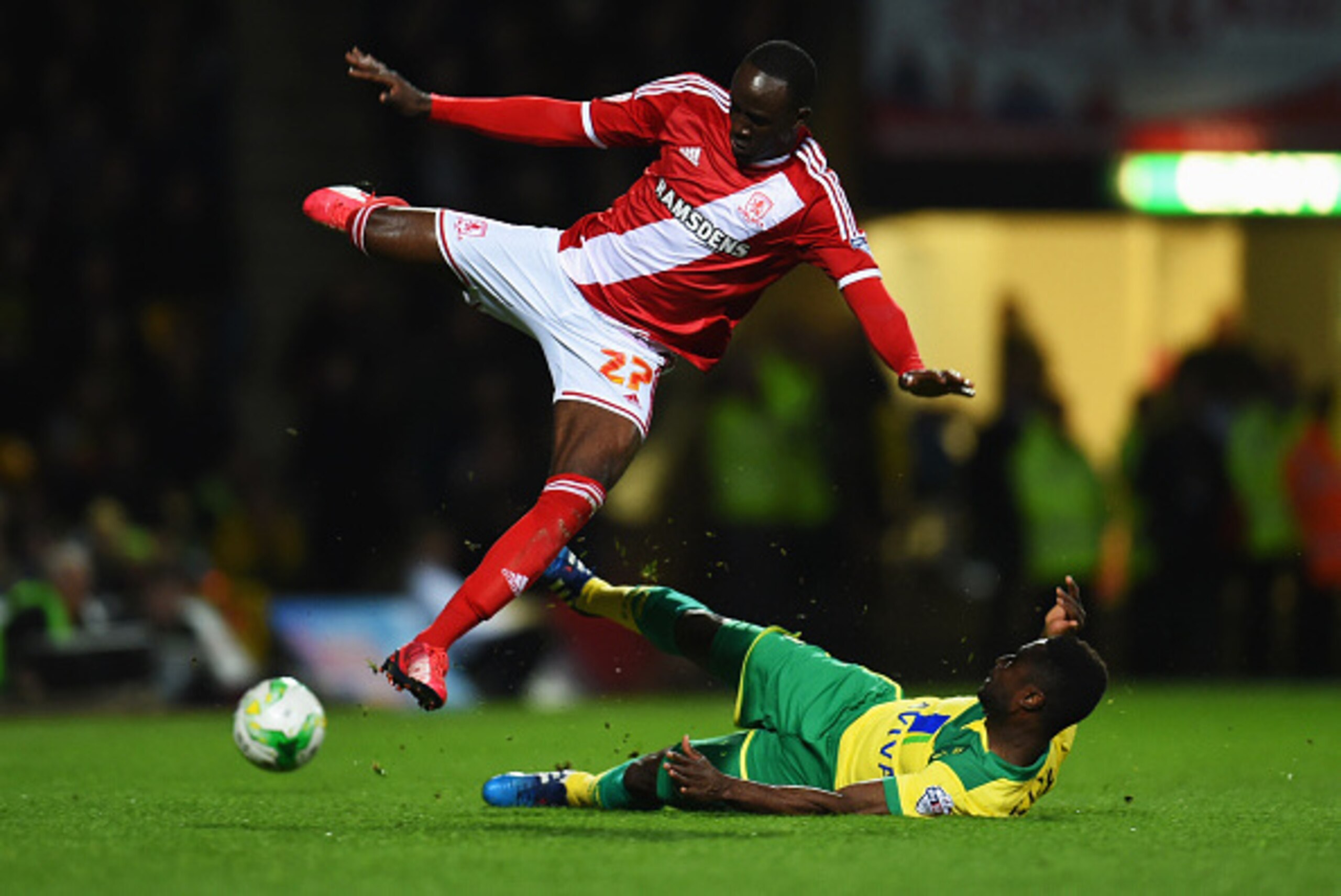 NORWICH, ENGLAND - APRIL 17: Albert Adomah of Middlesbrough is tackled by Alexander Tettey of Norwich City during the Sky Bet Championship match between Norwich City and Middlesbrough at Carrow Road on April 17, 2015 in Norwich, England. (Photo by Tom D NORWICH, ENGLAND - APRIL 17: Albert Adomah of Middlesbrough is tackled by Alexander Tettey of Norwich City during the Sky Bet Championship match between Norwich City and Middlesbrough at Carrow Road on April 17, 2015 in Norwich, England. (Photo by Tom D