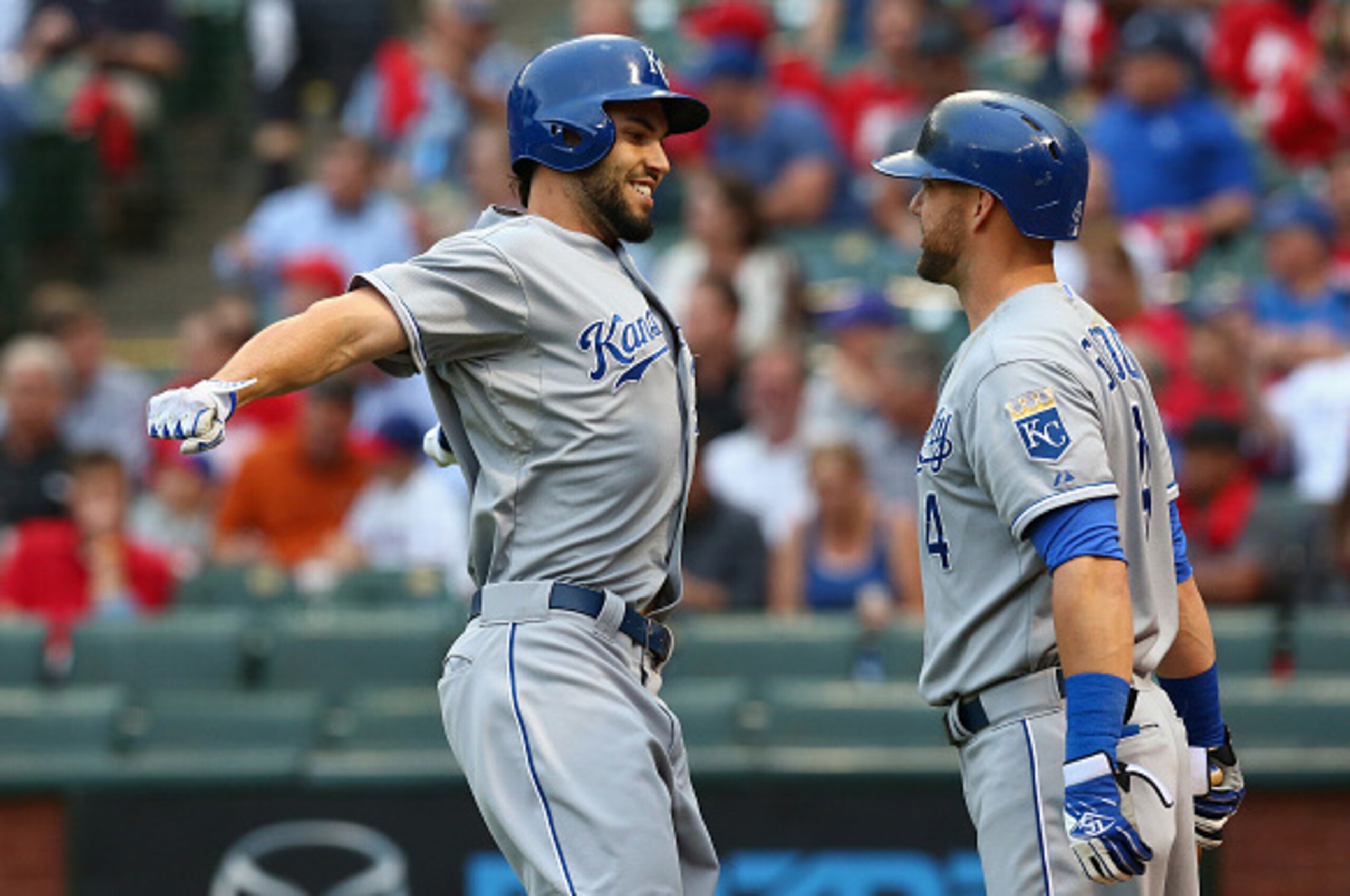 ARLINGTON, TX - MAY 12:  (L-R) Eric Hosmer #35 of the Kansas City Royals celebrates a homerun with Alex Gordon #4  against the Texas Rangers in the second inning at Globe Life Park in Arlington on May 12, 2015 in Arlington, Texas.  (Photo by Ronald Martin