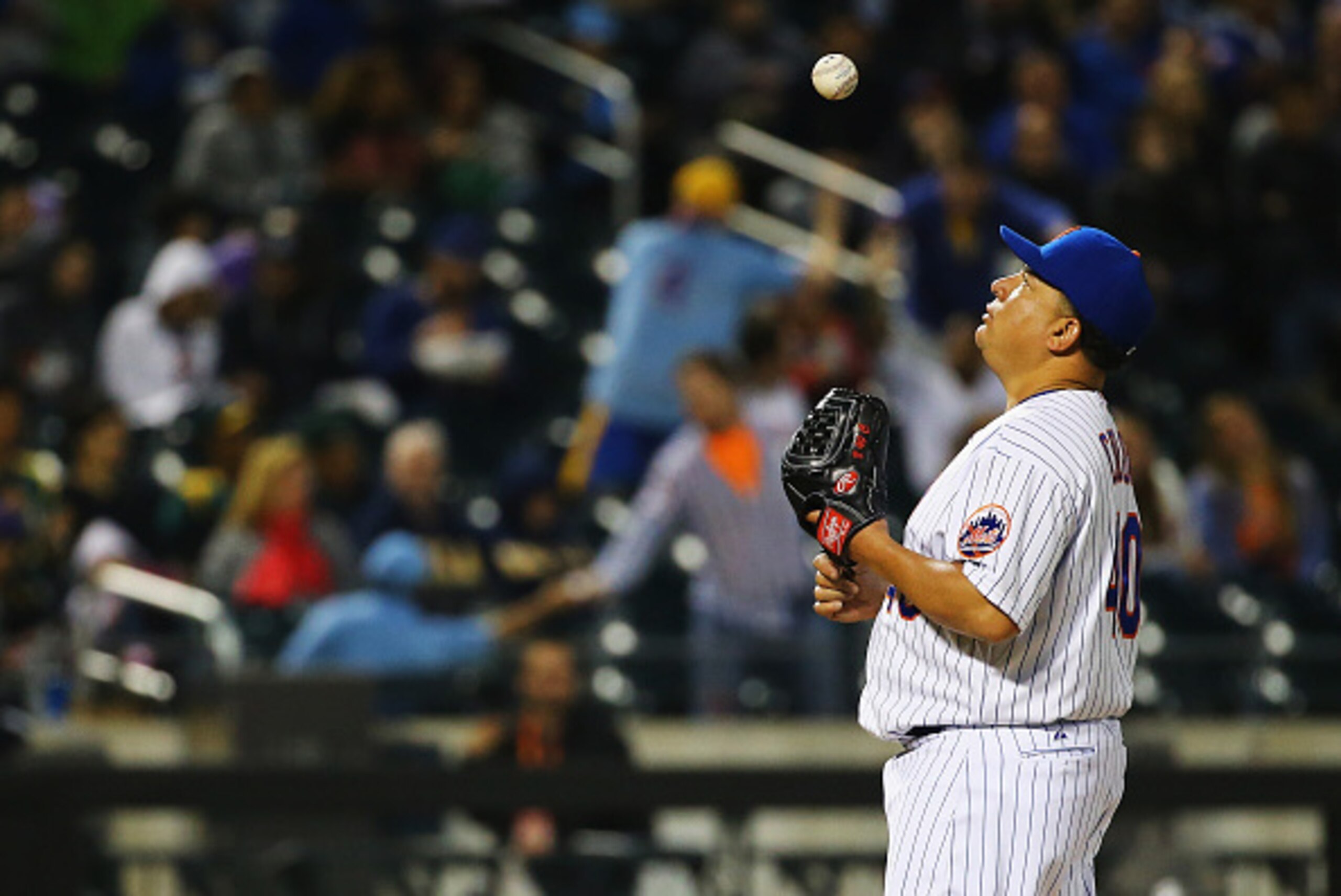 NEW YORK, NY - MAY 15:  Bartolo Colon #40 of the New York Mets reacts by throwing the ball in the air after giving up a home run against Gerardo Parra #28 of the Milwaukee Brewers in the fifth inning during their game at Citi Field on May 15, 2015 in New 
