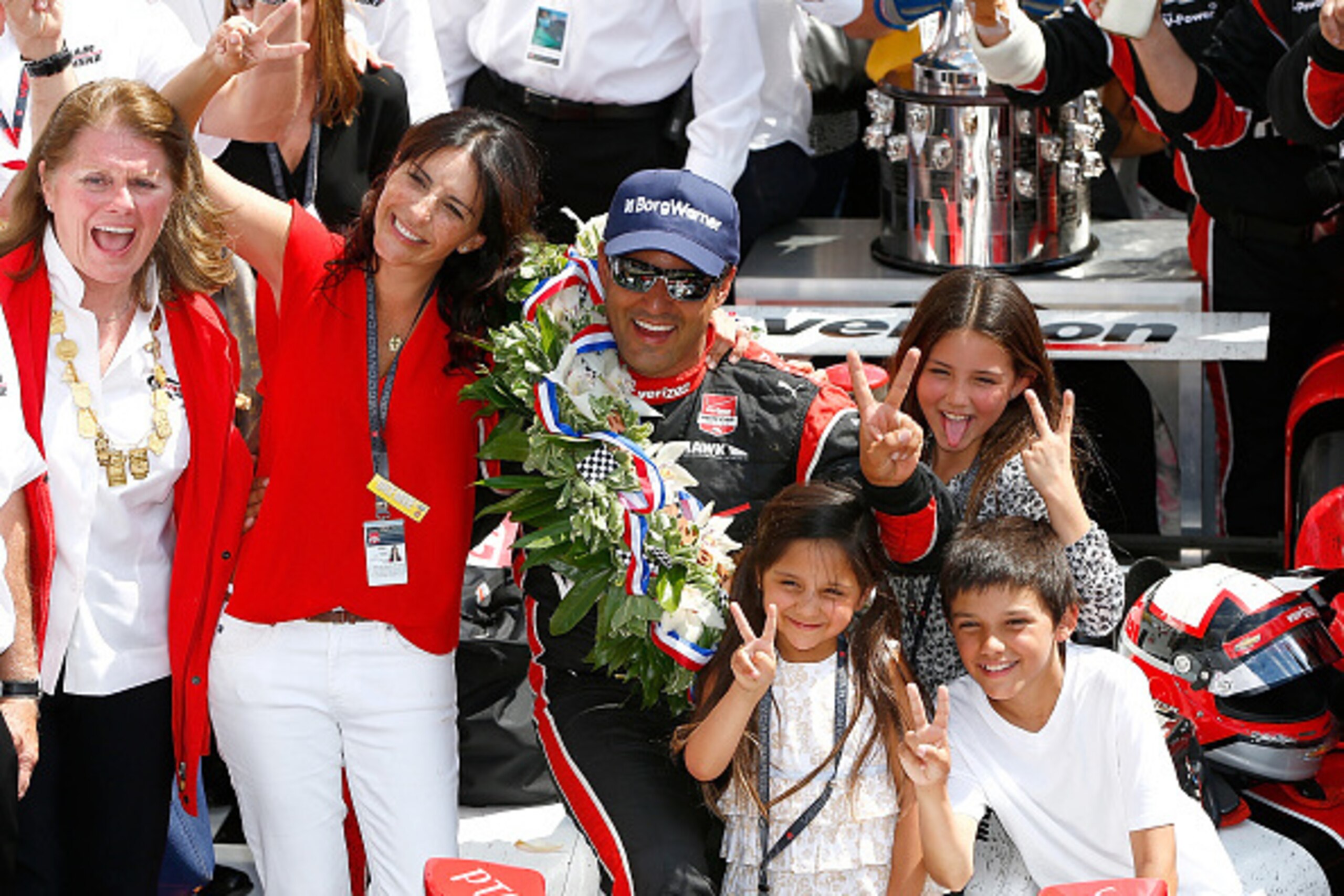 INDIANAPOLIS, IN - MAY 24: Juan-Pablo Montoya of Columbia, driver of the #2 Verizon Team Penske Chevrolet Dallara celebrates with his family in victory lane after winning the 99th running of the Indianapolis 500 Mile Race at Indianapolis Motorspeedway on INDIANAPOLIS, IN - MAY 24: Juan-Pablo Montoya of Columbia, driver of the #2 Verizon Team Penske Chevrolet Dallara celebrates with his family in victory lane after winning the 99th running of the Indianapolis 500 Mile Race at Indianapolis Motorspeedway on