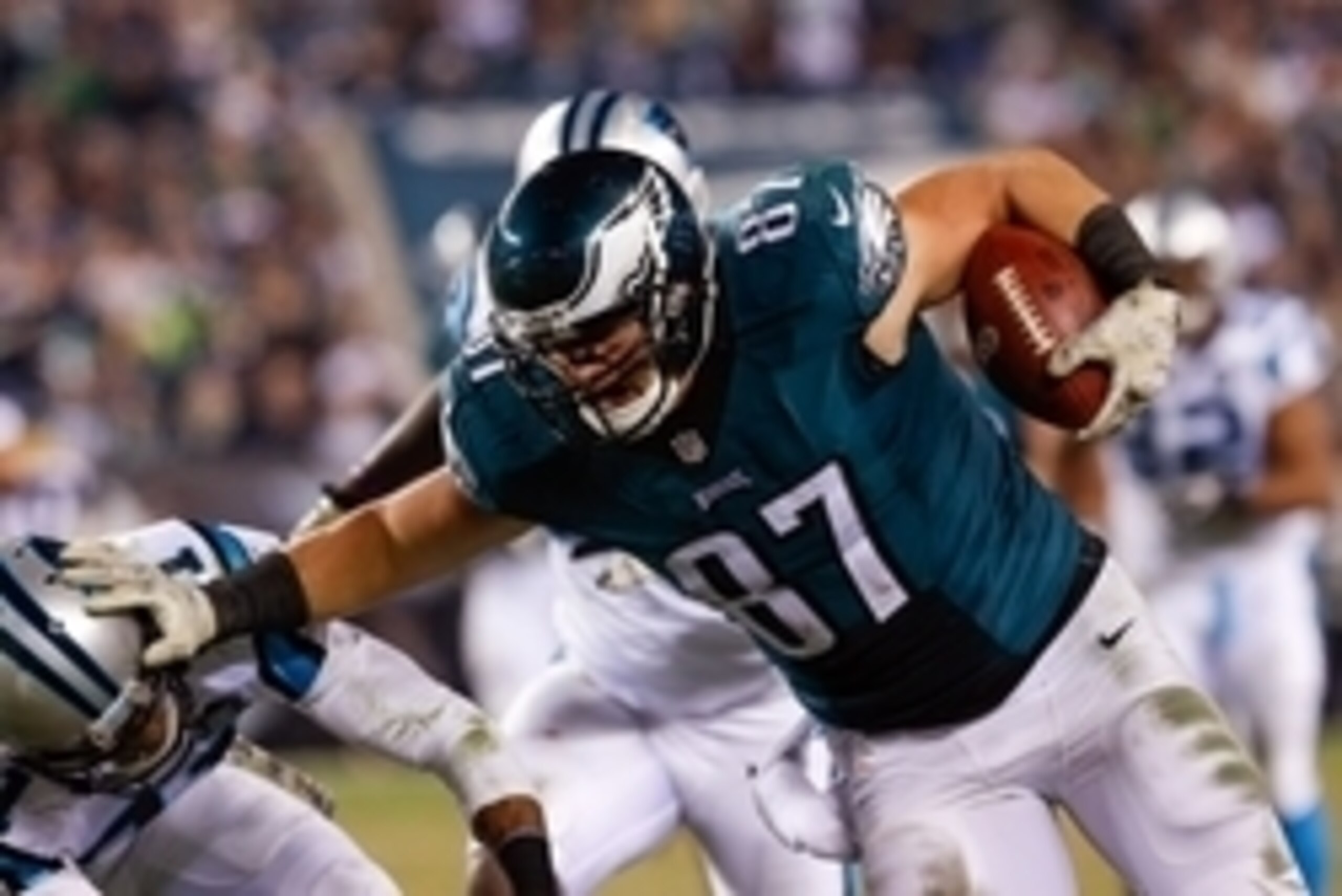 Nov 10, 2014; Philadelphia, PA, USA; Philadelphia Eagles tight end Brent Celek (87) catches the ball and stiff arms Carolina Panthers free safety Thomas DeCoud (21) during the second half at Lincoln Financial Field. The Eagles defeated the Panthers 45-21.