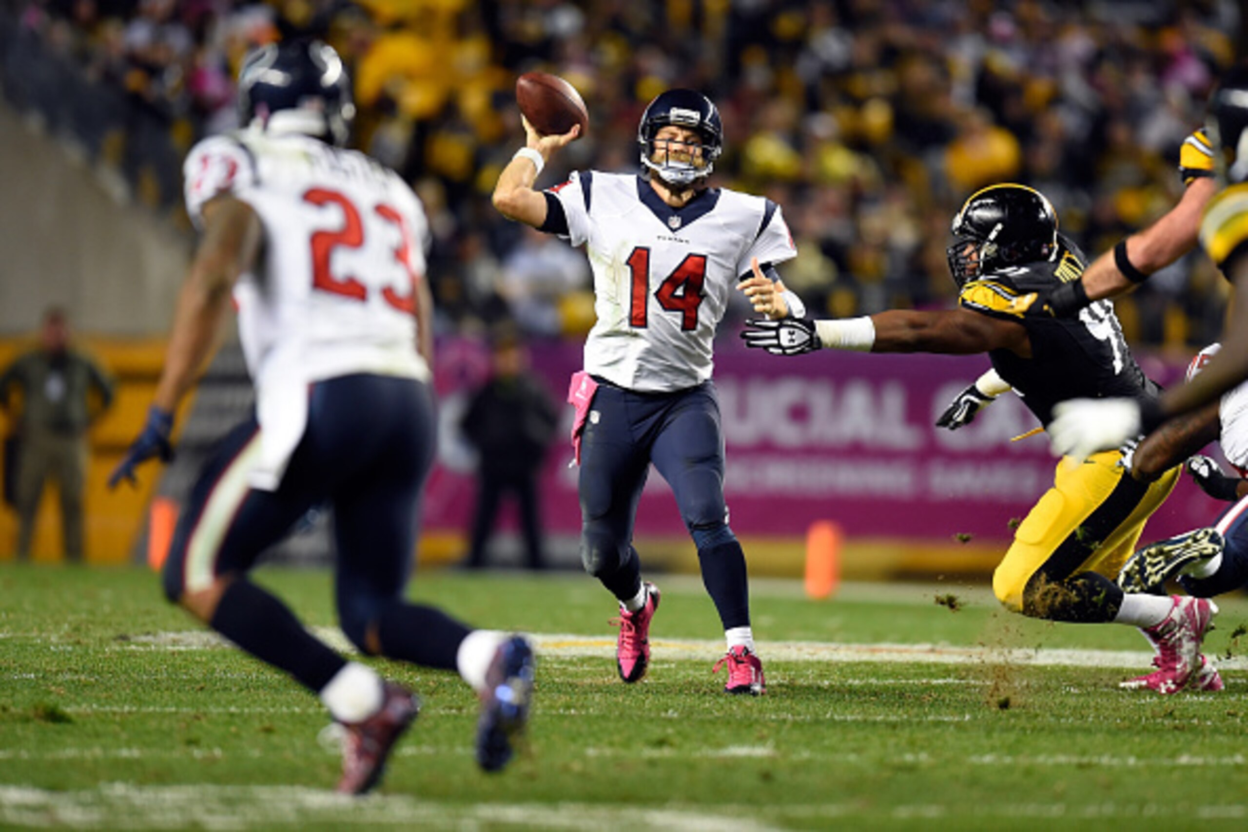 PITTSBURGH, PA - OCTOBER 20:   Ryan Fitzpatrick #14 of the Houston Texans throws a pass against  Stephon Tuitt #91 of the Pittsburgh Steelers in the fourth quarter during their game at Heinz Field on October 20, 2014 in Pittsburgh, Pennsylvania.  (Photo b