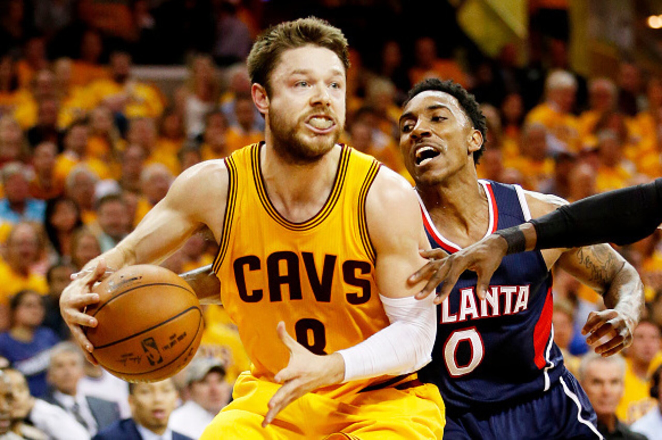 CLEVELAND, OH - MAY 24:  Matthew Dellavedova #8 of the Cleveland Cavaliers drives against Jeff Teague #0 of the Atlanta Hawks in the fourth quarter during Game Three of the Eastern Conference Finals of the 2015 NBA Playoffs at Quicken Loans Arena on May 2
