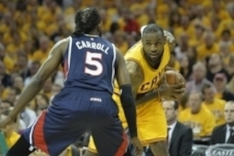 May 24, 2015; Cleveland, OH, USA; Cleveland Cavaliers forward LeBron James (23) looks to make a play aginat Atlanta Hawks forward DeMarre Carroll (5) in game three of the Eastern Conference Finals of the NBA Playoffs at Quicken Loans Arena. Mandatory Cred