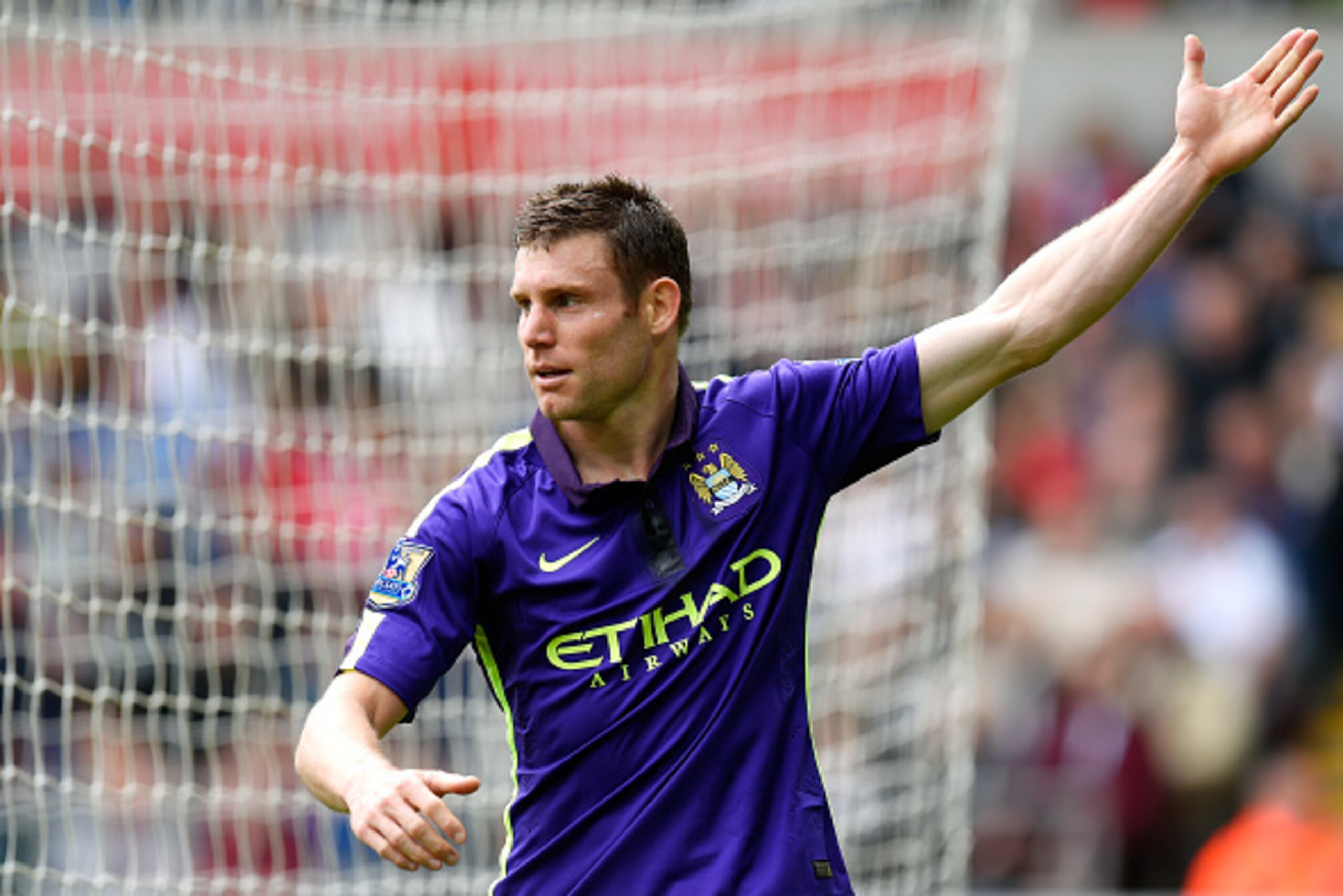 SWANSEA, WALES - MAY 17:  James Milner of Manchester City celebrates after scoring his team's second goal during the Barclays Premier League match between Swansea and Manchester City at the Liberty Stadium on May 17, 2015 in Swansea, Wales.  (Photo by Stu