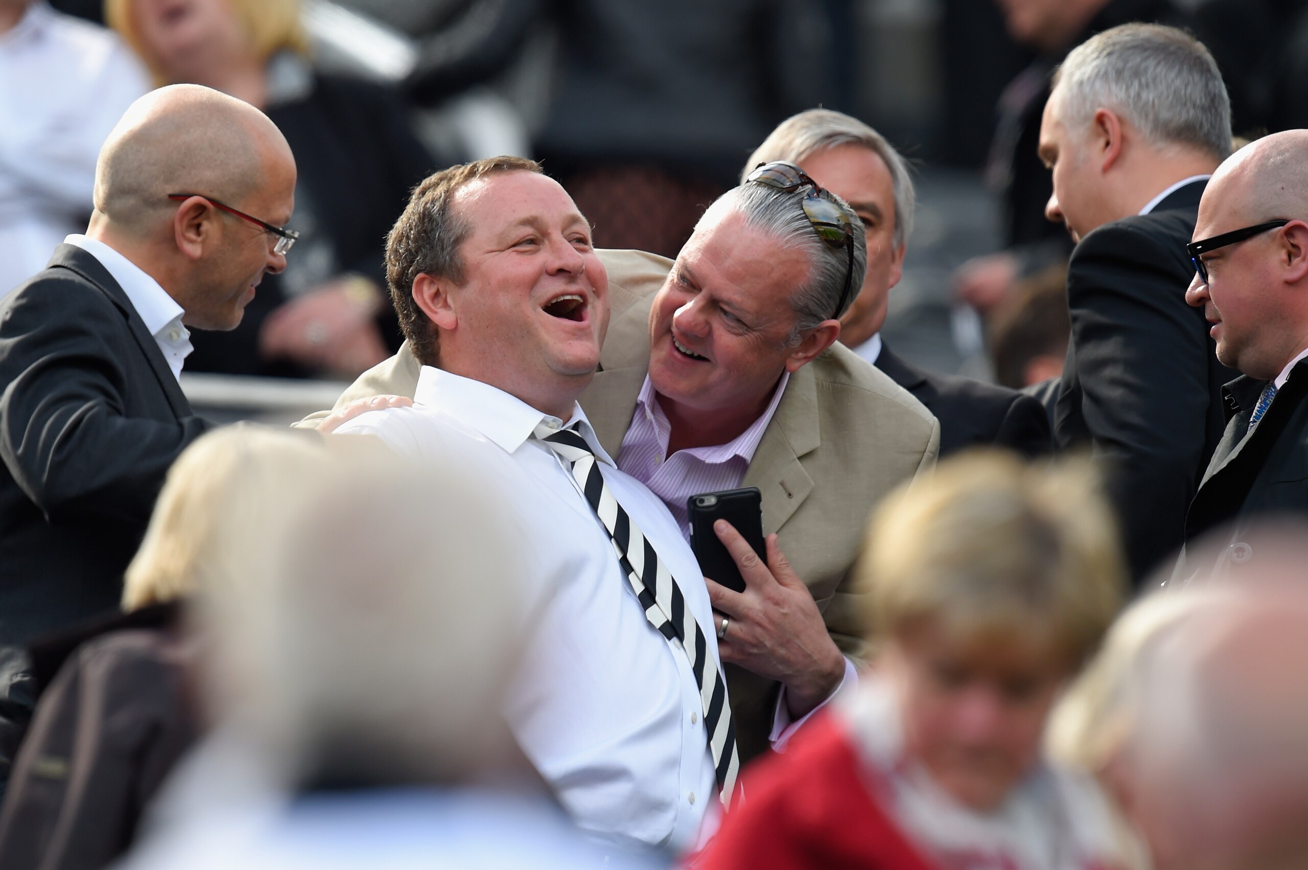 NEWCASTLE UPON TYNE, ENGLAND - MAY 24: Newcastle owner Mike Ashley (2nd left) shares a joke before the Barclays Premier League match between Newcastle United and West Ham United at St James' Park on May 24, 2015 in Newcastle upon Tyne, England.  (Photo by