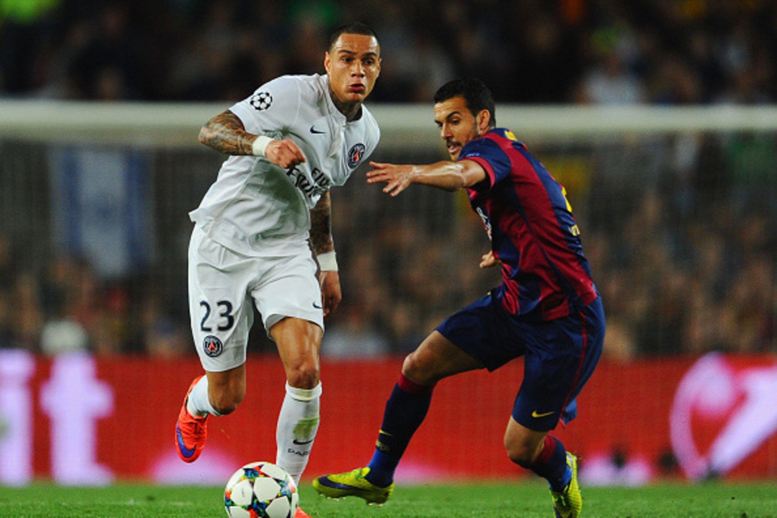BARCELONA, SPAIN - APRIL 21:  Gregory van der Wiel of PSG evades Pedro of Barcelona during the UEFA Champions League Quarter Final second leg match between FC Barcelona and Paris Saint-Germain at Camp Nou on April 21, 2015 in Barcelona, Spain.  (Photo by 