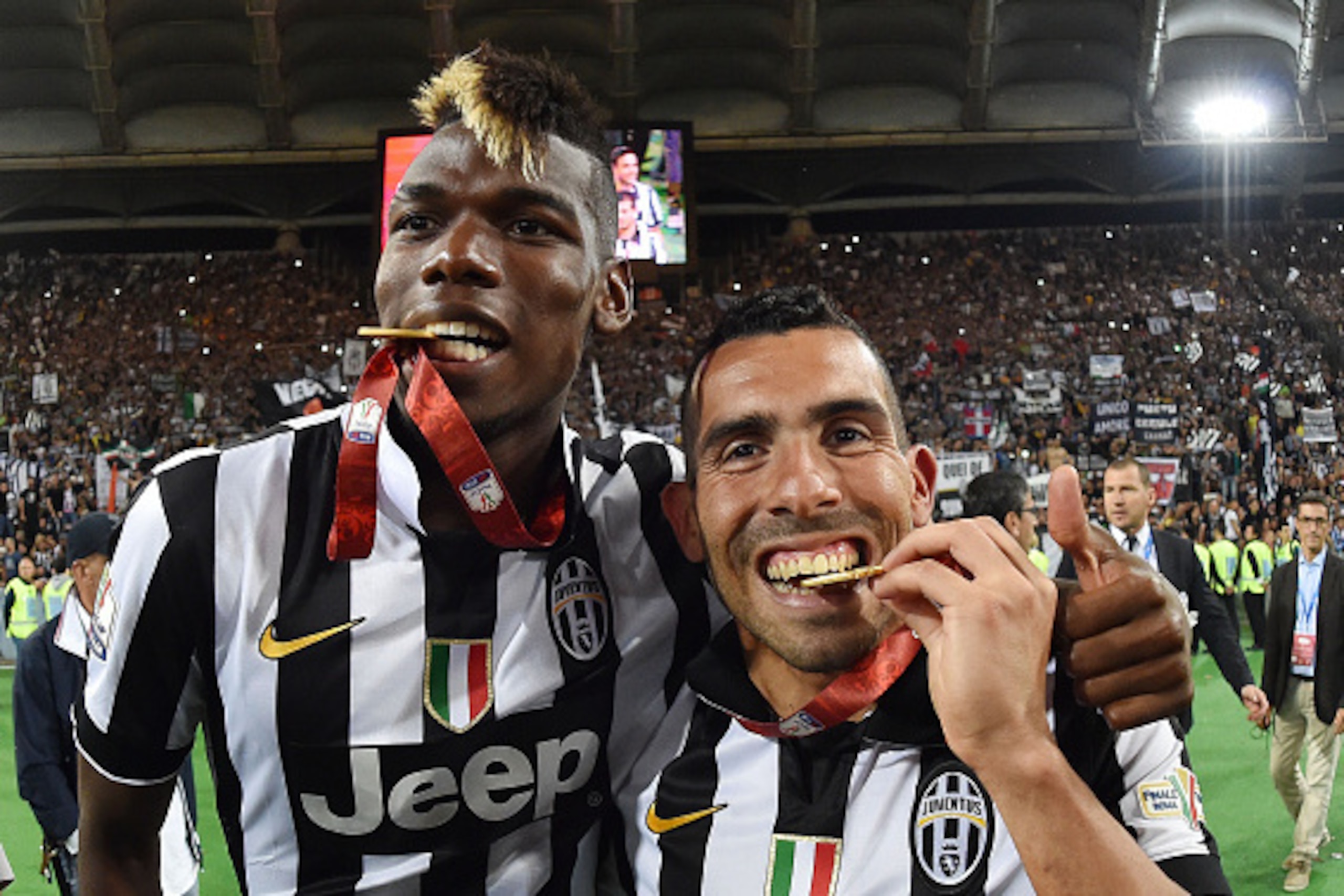 ROME, ITALY - MAY 20:  Paul Pogba and Carlos Tevez of Juventus celebrate the victory after the TIM Cup final match between SS Lazio and Juventus FC at Olimpico Stadium on May 20, 2015 in Rome, Italy.  (Photo by Giuseppe Bellini/Getty Images)