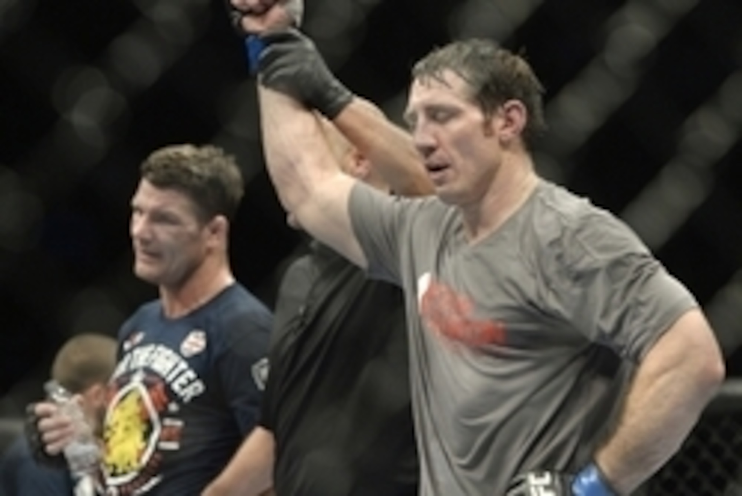 Apr 16, 2014; Quebec City, Quebec, Canada; Tim Kennedy (blue gloves) is declared the winner in his fight against Michael Bisping (red gloves) after their middleweight bout at Colisee Pepsi. Mandatory Credit: Eric Bolte-USA TODAY Sports
