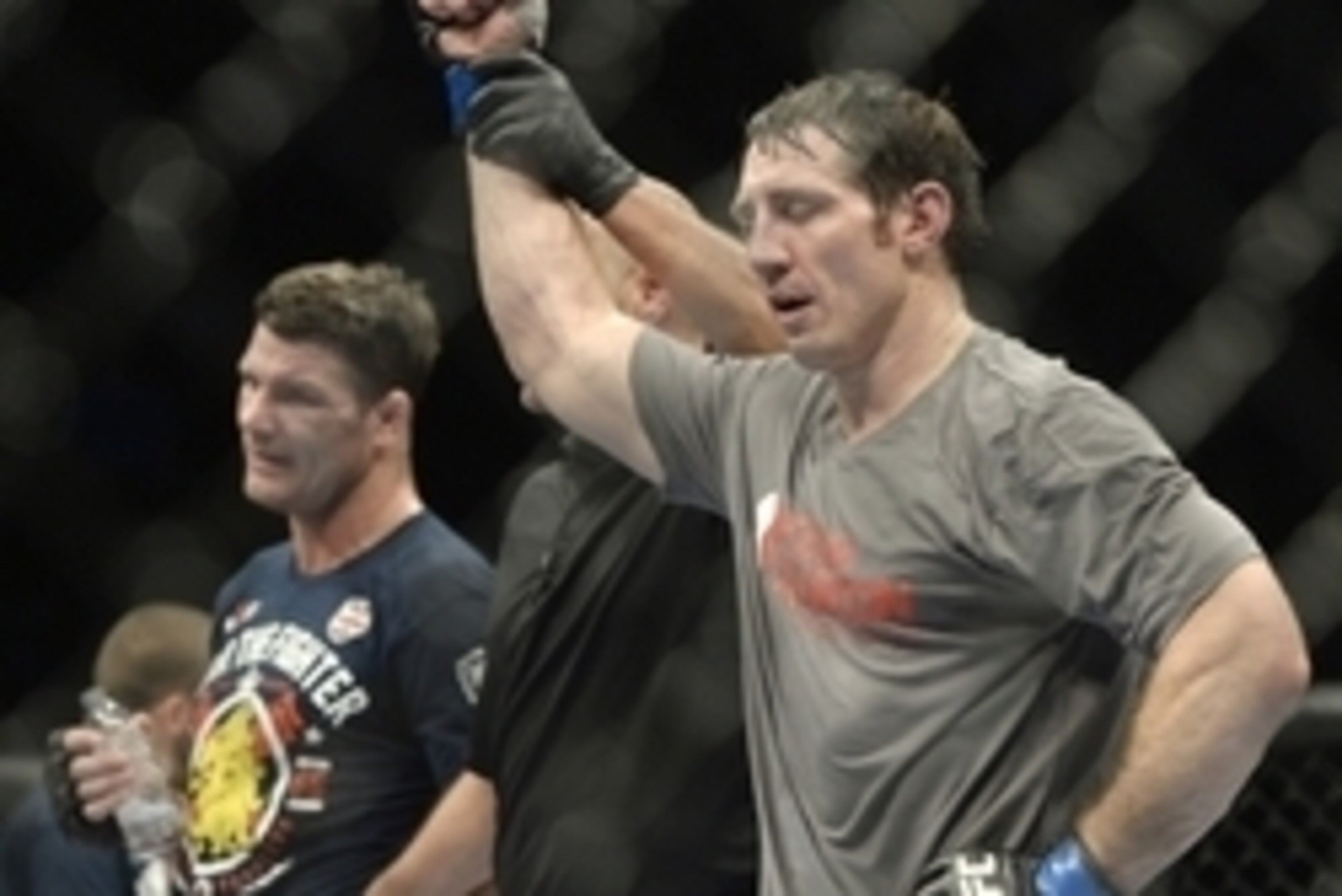 Apr 16, 2014; Quebec City, Quebec, Canada; Tim Kennedy (blue gloves) is declared the winner in his fight against Michael Bisping (red gloves) after their middleweight bout at Colisee Pepsi. Mandatory Credit: Eric Bolte-USA TODAY Sports