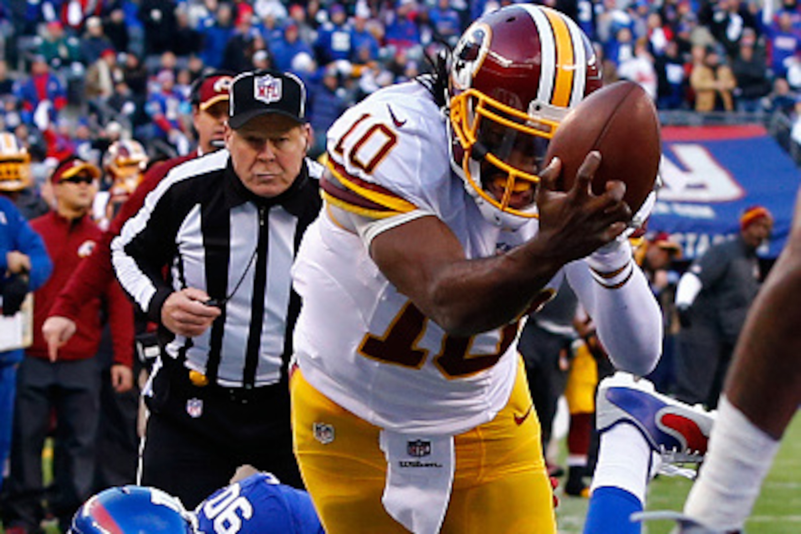 EAST RUTHERFORD, NJ - DECEMBER 14:  Robert Griffin III #10 of the Washington Redskins fumbles the ball out of bounds in End Zone in the second quarter against the New York Giants during their game at MetLife Stadium on December 14, 2014 in East Rutherford