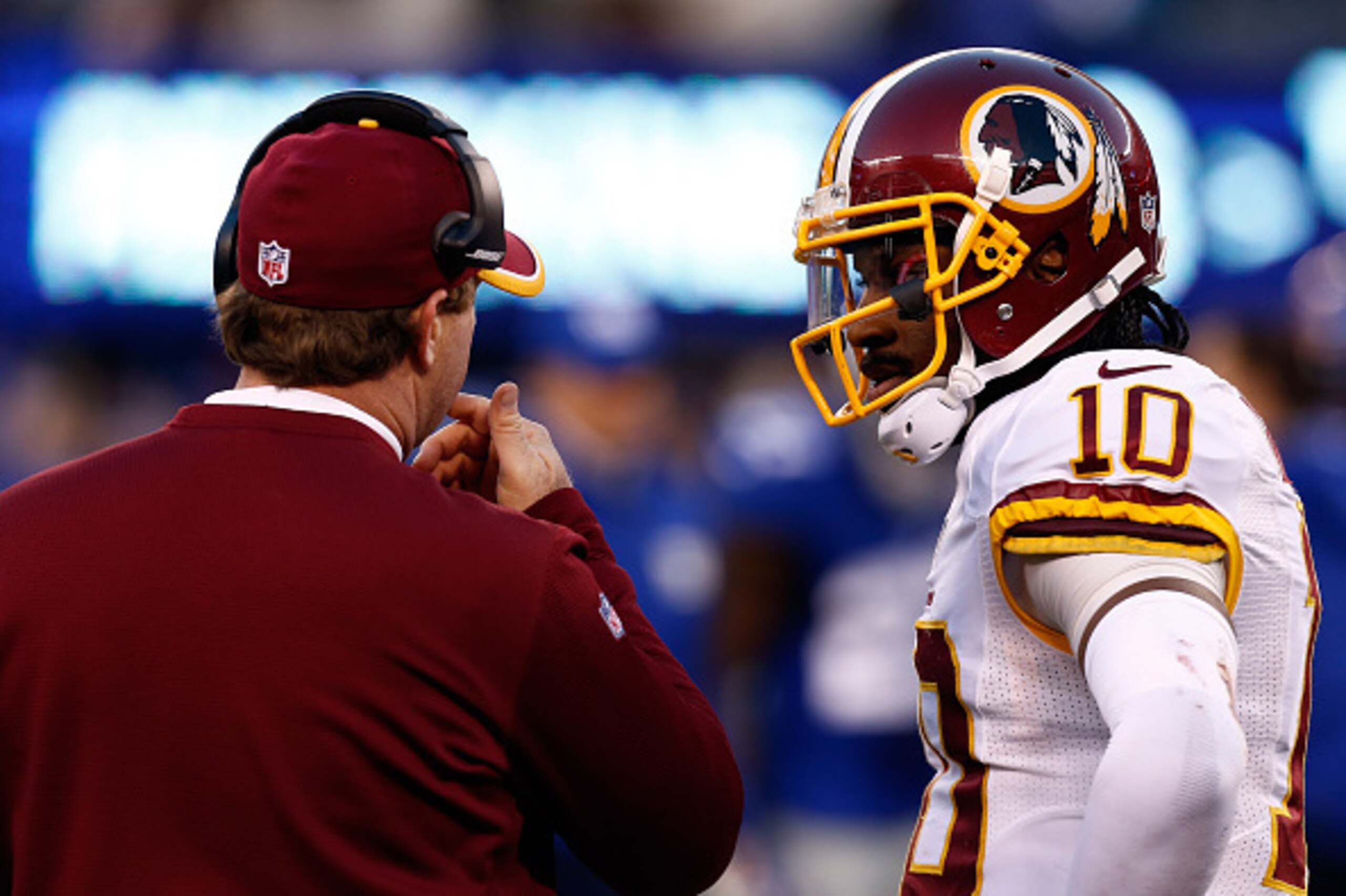 EAST RUTHERFORD, NJ - DECEMBER 14:  Head coach Jay Gruden talks with Robert Griffin III #10 of the Washington Redskins on the sidelines against the New York Giants during their game at MetLife Stadium on December 14, 2014 in East Rutherford, New Jersey.  