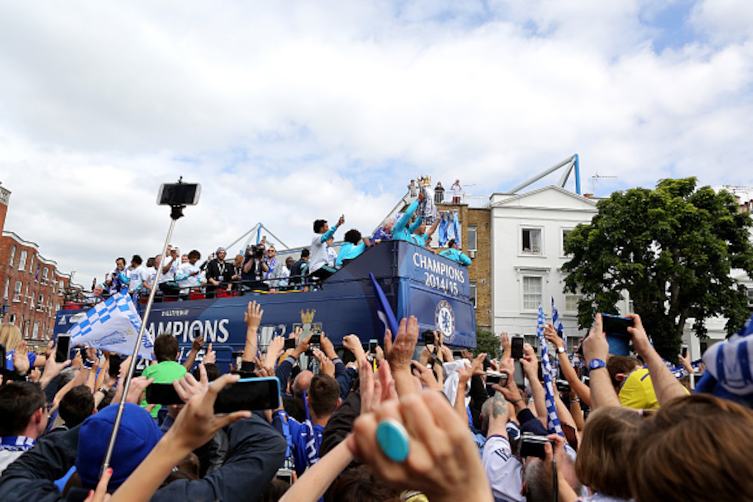 LONDON, ENGLAND - MAY 25: Didier Drogba and John Terry hold up the Premier League trophy and League Cup trophy as they exit the stadium during the Chelsea FC Premier League Victory Parade on May 25, 2015 in London, England.  (Photo by Charlie Crowhurst/Ge