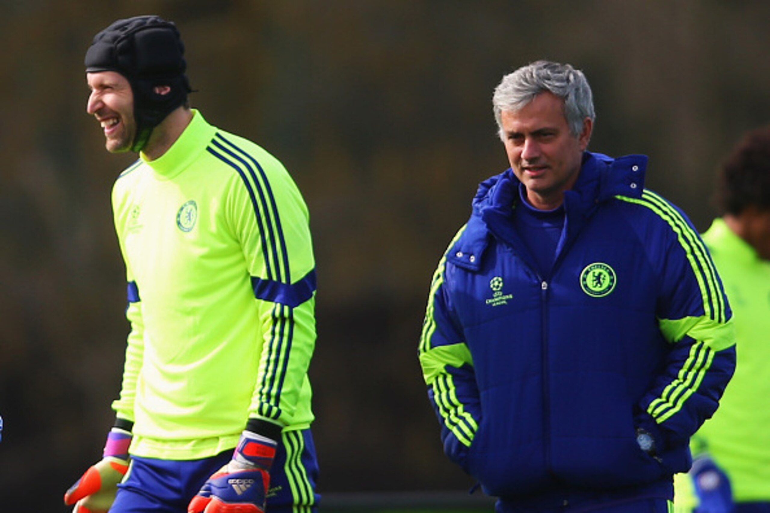 COBHAM, ENGLAND - MARCH 10: Jose Mourinho manager of Chelsea (R) and goalkeeper Petr Cech (2R) smile during a Chelsea training session ahead of the UEFA Champions League Round of 16 second leg match against Paris Saint-Germain at Chelsea Training Ground COBHAM, ENGLAND - MARCH 10: Jose Mourinho manager of Chelsea (R) and goalkeeper Petr Cech (2R) smile during a Chelsea training session ahead of the UEFA Champions League Round of 16 second leg match against Paris Saint-Germain at Chelsea Training Ground