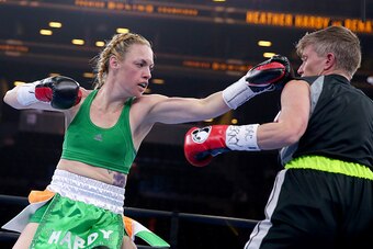 NEW YORK, NY - APRIL 11:  Heather Hardy and Renata Domsodi exchange punches during the Premier Boxing Champions Junior Featherweight bout at Barclays Center on April 11, 2015 in New York City.  (Photo by Elsa/Getty Images)