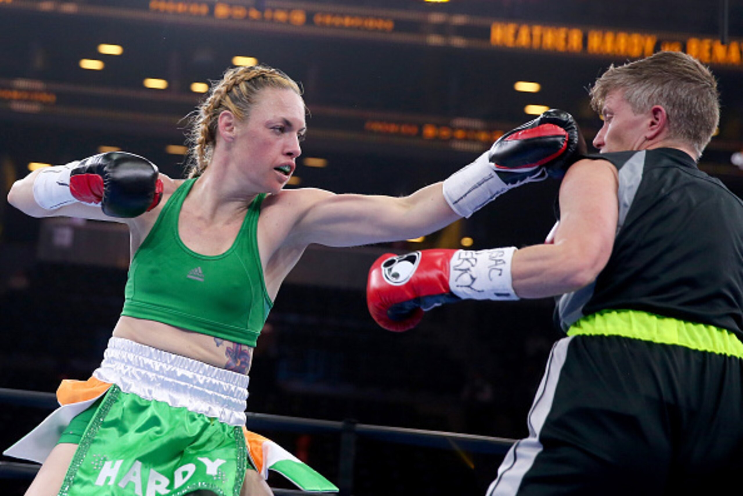 NEW YORK, NY - APRIL 11:  Heather Hardy and Renata Domsodi exchange punches during the Premier Boxing Champions Junior Featherweight bout at Barclays Center on April 11, 2015 in New York City.  (Photo by Elsa/Getty Images)