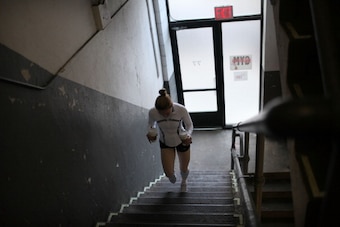 NEW YORK, NY - APRIL 04:  Female boxer Heather Hardy climbs up steps after getting coffee while training at Gleason's Gym on April 4, 2012 in New York City. Hardy, a 30 year old single mother who wants to turn pro, has been boxing seriously for two years 