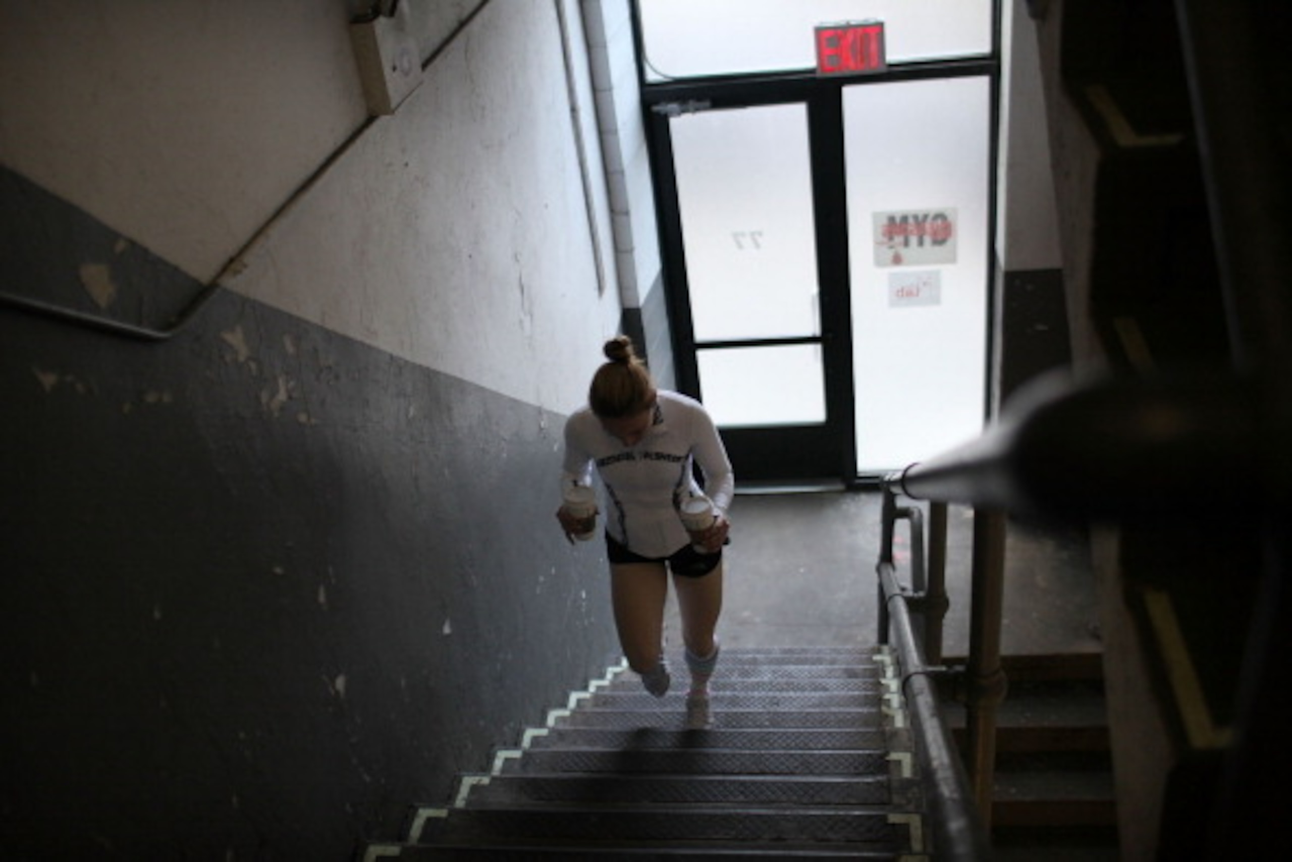 NEW YORK, NY - APRIL 04:  Female boxer Heather Hardy climbs up steps after getting coffee while training at Gleason's Gym on April 4, 2012 in New York City. Hardy, a 30 year old single mother who wants to turn pro, has been boxing seriously for two years 