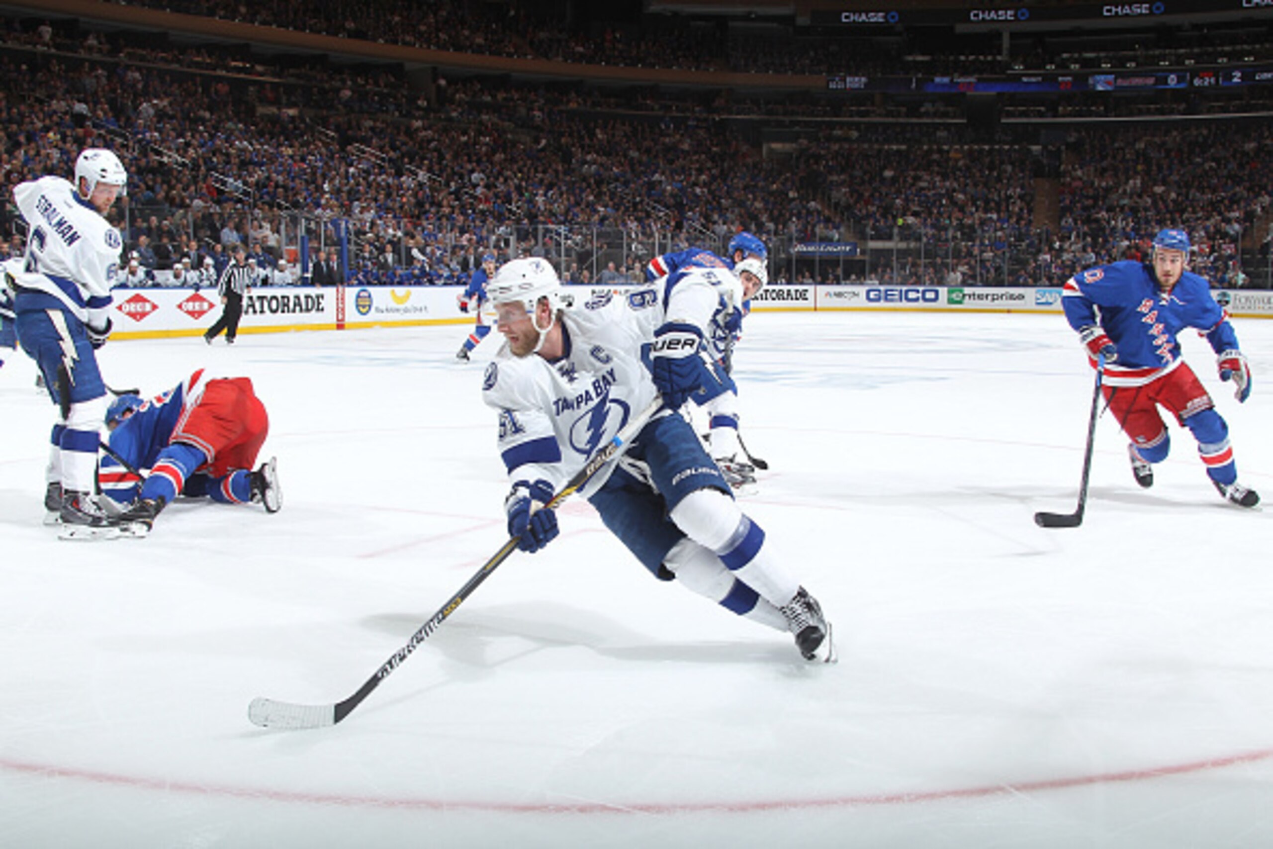 NEW YORK, NY - MAY 24:  Steven Stamkos #91 of the Tampa Bay Lightning picks up the puck after a face-off against the New York Rangers in Game Five of the Eastern Conference Final during the 2015 NHL Stanley Cup Playoffs at Madison Square Garden on May 24,