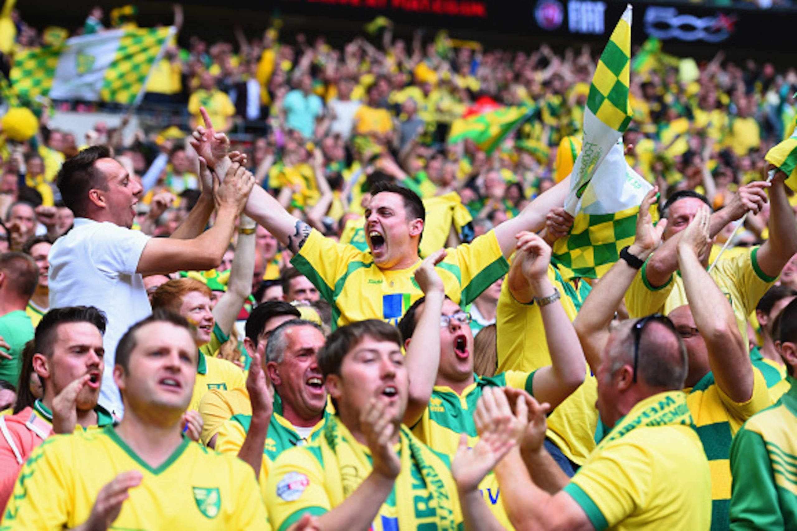 LONDON, ENGLAND - MAY 25:  Norwich City fans celebrate during the Sky Bet Championship Playoff Final between Middlesbrough and Norwich City at Wembley Stadium on May 25, 2015 in London, England.  (Photo by Laurence Griffiths/Getty Images)