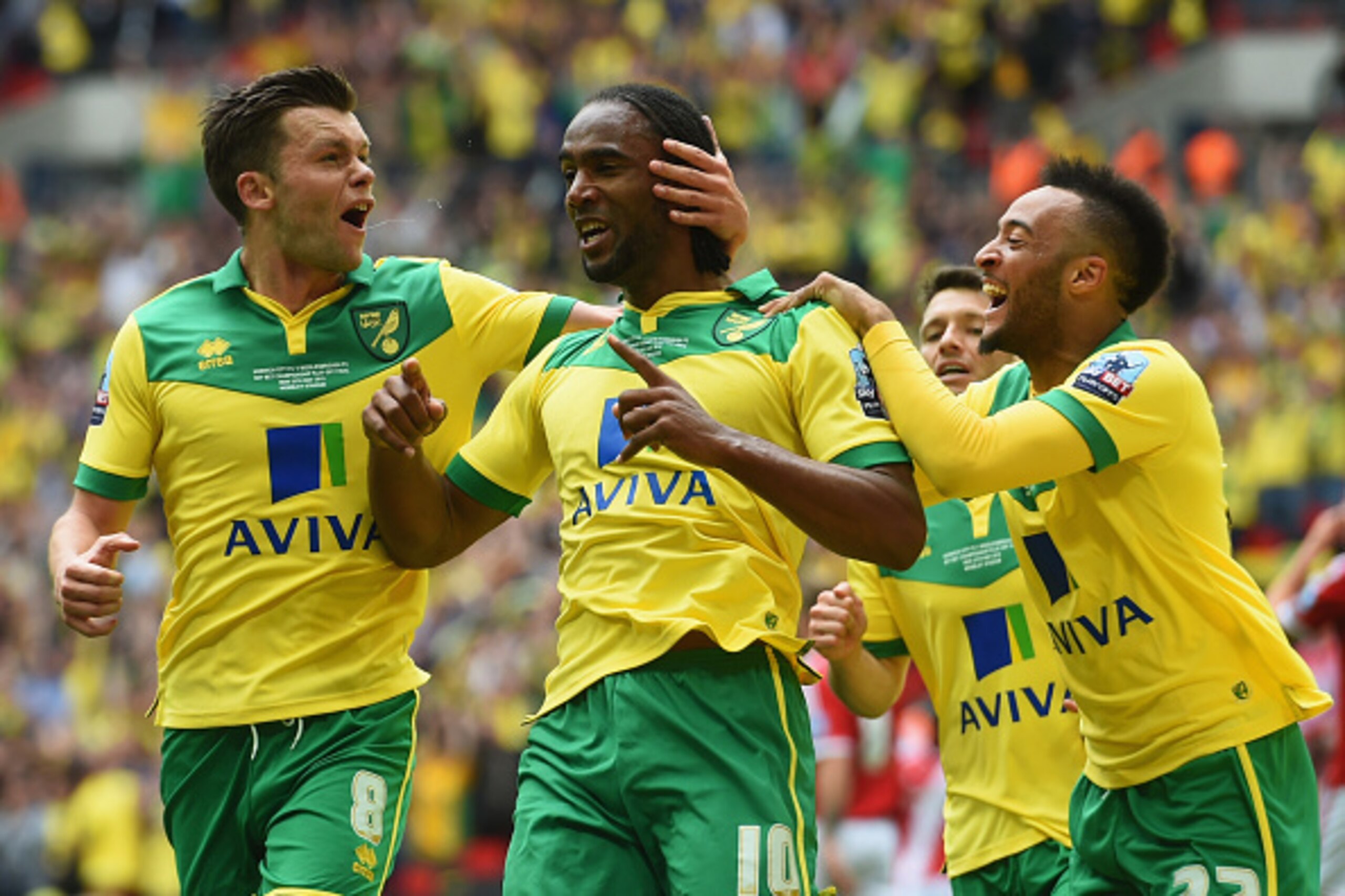 LONDON, ENGLAND - MAY 25:  Cameron Jerome of Norwich City (10) celebrates as he scores their first goal with Jonathan Howson (8) and Nathan Redmond (22) during the Sky Bet Championship Playoff Final between Middlesbrough and Norwich City at Wembley Stadiu