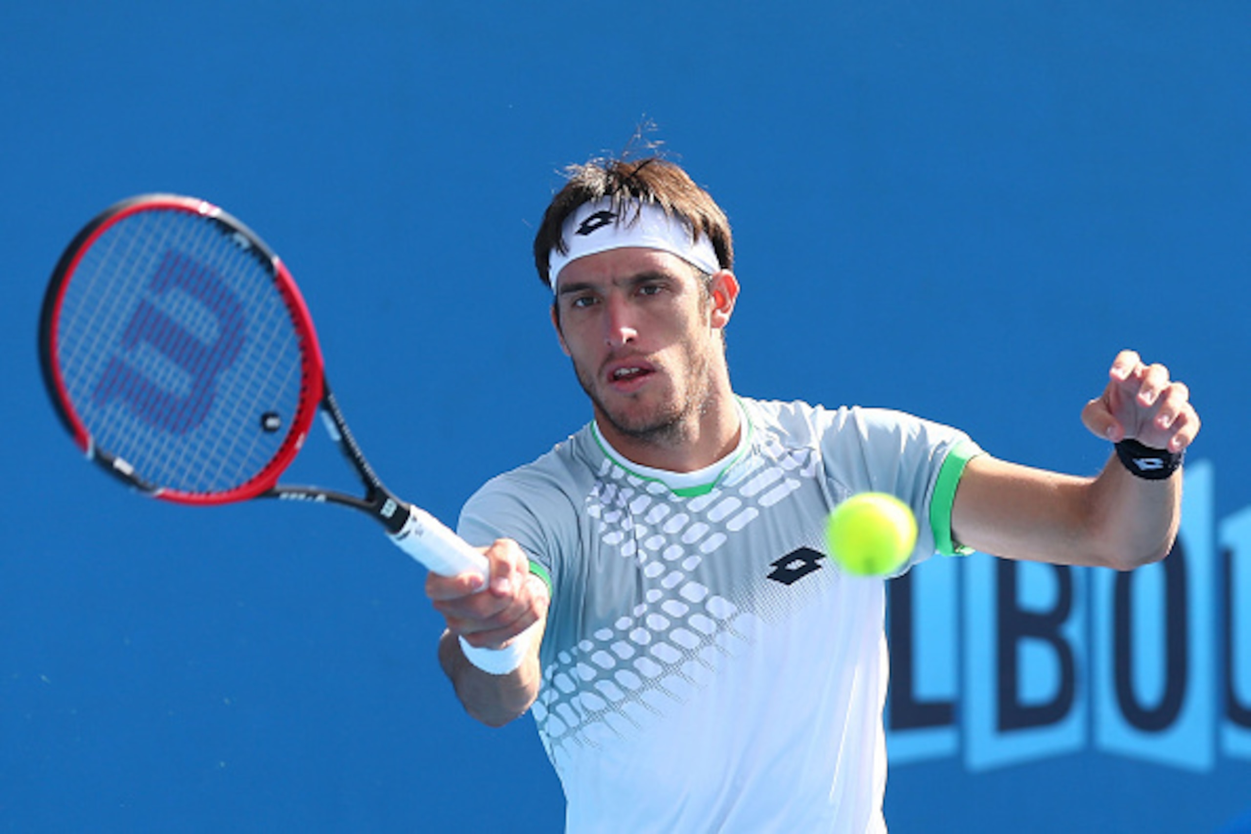 MELBOURNE, AUSTRALIA - JANUARY 19:  Leonardo Mayer of Argentina plays a forehand in his first round match against John Millman of Australia during day one of the 2015 Australian Open at Melbourne Park on January 19, 2015 in Melbourne, Australia.  (Photo b