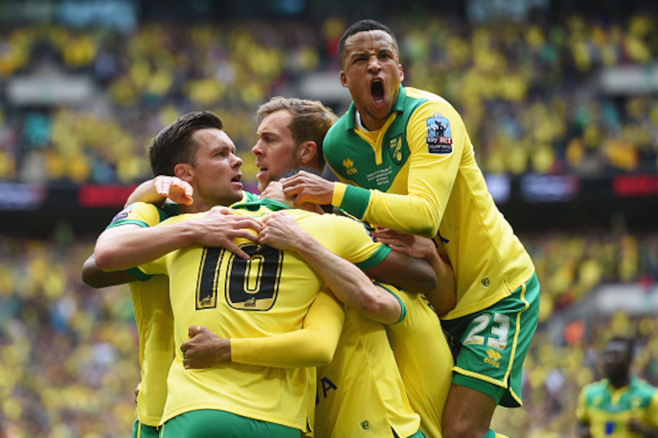 LONDON, ENGLAND - MAY 25:  Cameron Jerome of Norwich City (10) is congratulated by Martin Olsson (23) and team mates as he scores their first goal during the Sky Bet Championship Playoff Final between Middlesbrough and Norwich City at Wembley Stadium on M