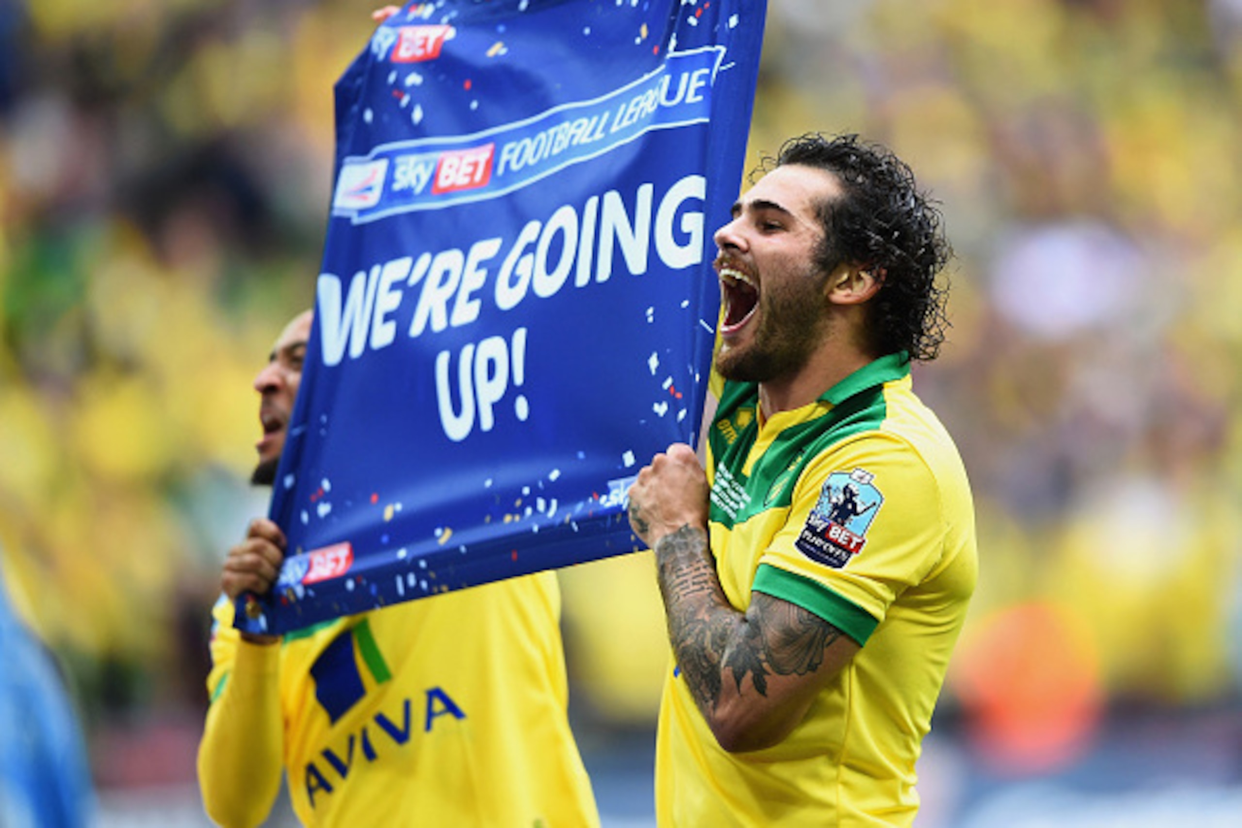 LONDON, ENGLAND - MAY 25:  Nathan Redmond (L) and Bradley Johnson of Norwich City celebrate promotion after the Sky Bet Championship Playoff Final between Middlesbrough and Norwich City at Wembley Stadium on May 25, 2015 in London, England. Norwich City s