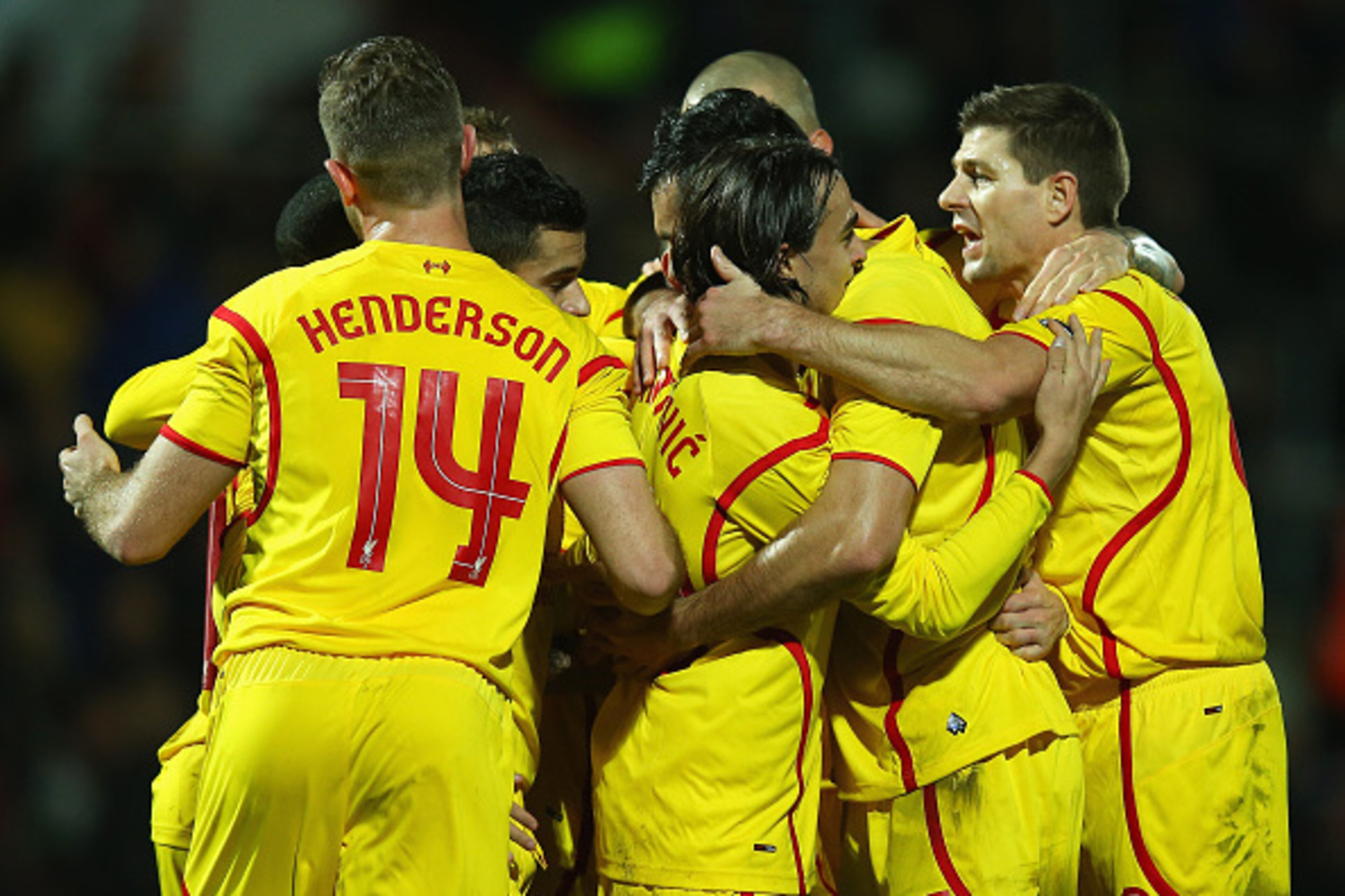 BOURNEMOUTH, ENGLAND - DECEMBER 17:  Lazar Markovic of Liverpool celebrates scoring his team's second goal with team mates during the Capital One Cup Quarter-Final match between Bournemouth and Liverpool at Goldsands Stadium on December 17, 2014 in Bourne