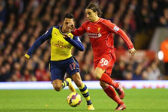 LIVERPOOL, ENGLAND - DECEMBER 21:  Lazar Markovic of Liverpool is closed down by Alexis Sanchez of Arsenal during the Barclays Premier League match between Liverpool and Arsenal at Anfield on December 21, 2014 in Liverpool, England.  (Photo by Alex Livese