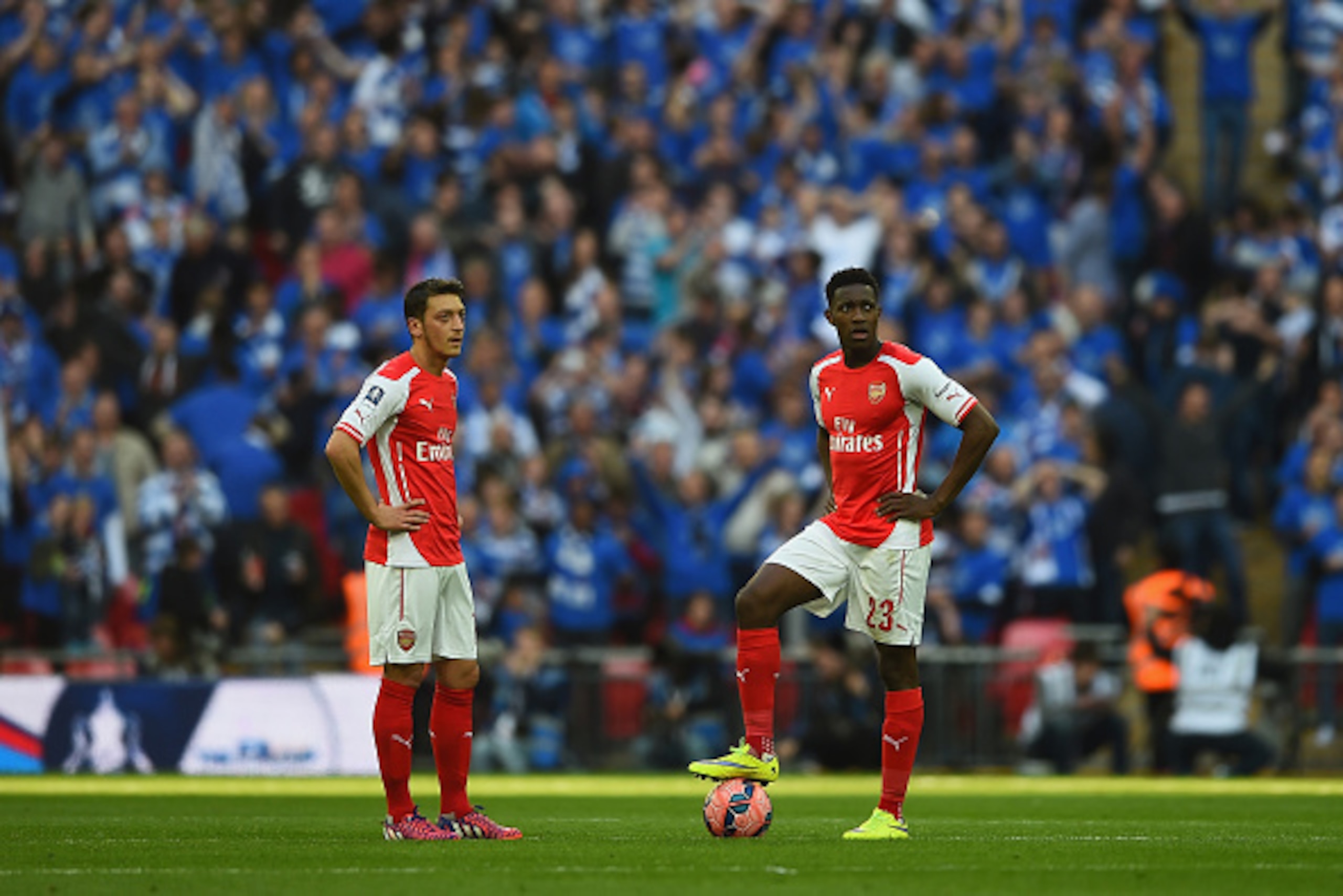 LONDON, ENGLAND - APRIL 18:  Mesut Oezil of Arsenal and Danny Welbeck of Arsenal look on after Reading scored their first goal during the FA Cup Semi Final between Arsenal and Reading at Wembley Stadium on April 18, 2015 in London, England.  (Photo by Lau