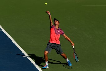 NEW YORK, NY - SEPTEMBER 07:  Omar Jasika of Australia serves Quentin Halys of France during their junior boys' singles final match on Day fourteen of the 2014 US Open at the USTA Billie Jean King National Tennis Center on September 7, 2014 in the Flushin