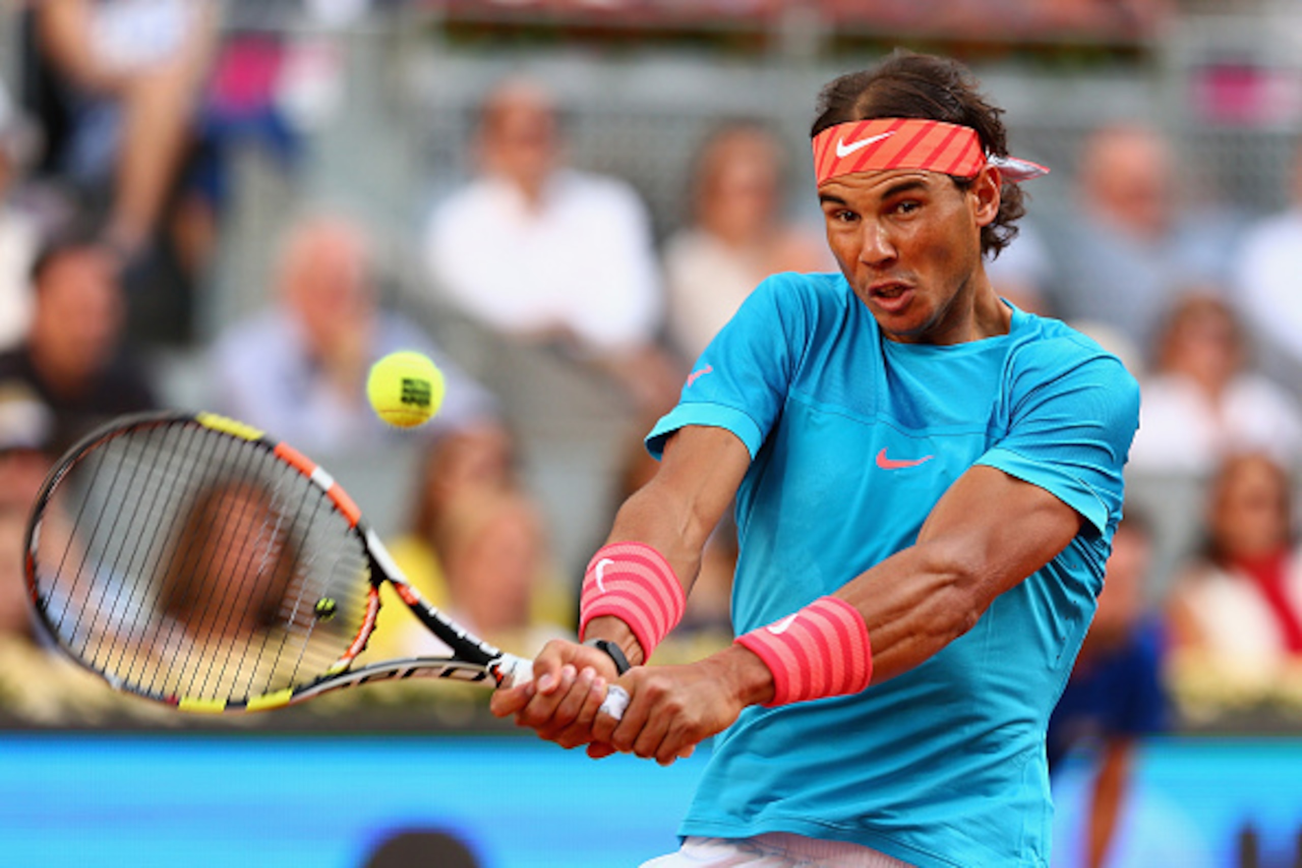 MADRID, SPAIN - MAY 10: Rafael Nadal of Spain plays a backhand against Andy Murray of Great Britain in the mens final during day nine of the Mutua Madrid Open tennis tournament at the Caja Magica on May 10, 2015 in Madrid, Spain. (Photo by Clive Brun MADRID, SPAIN - MAY 10: Rafael Nadal of Spain plays a backhand against Andy Murray of Great Britain in the mens final during day nine of the Mutua Madrid Open tennis tournament at the Caja Magica on May 10, 2015 in Madrid, Spain. (Photo by Clive Brun