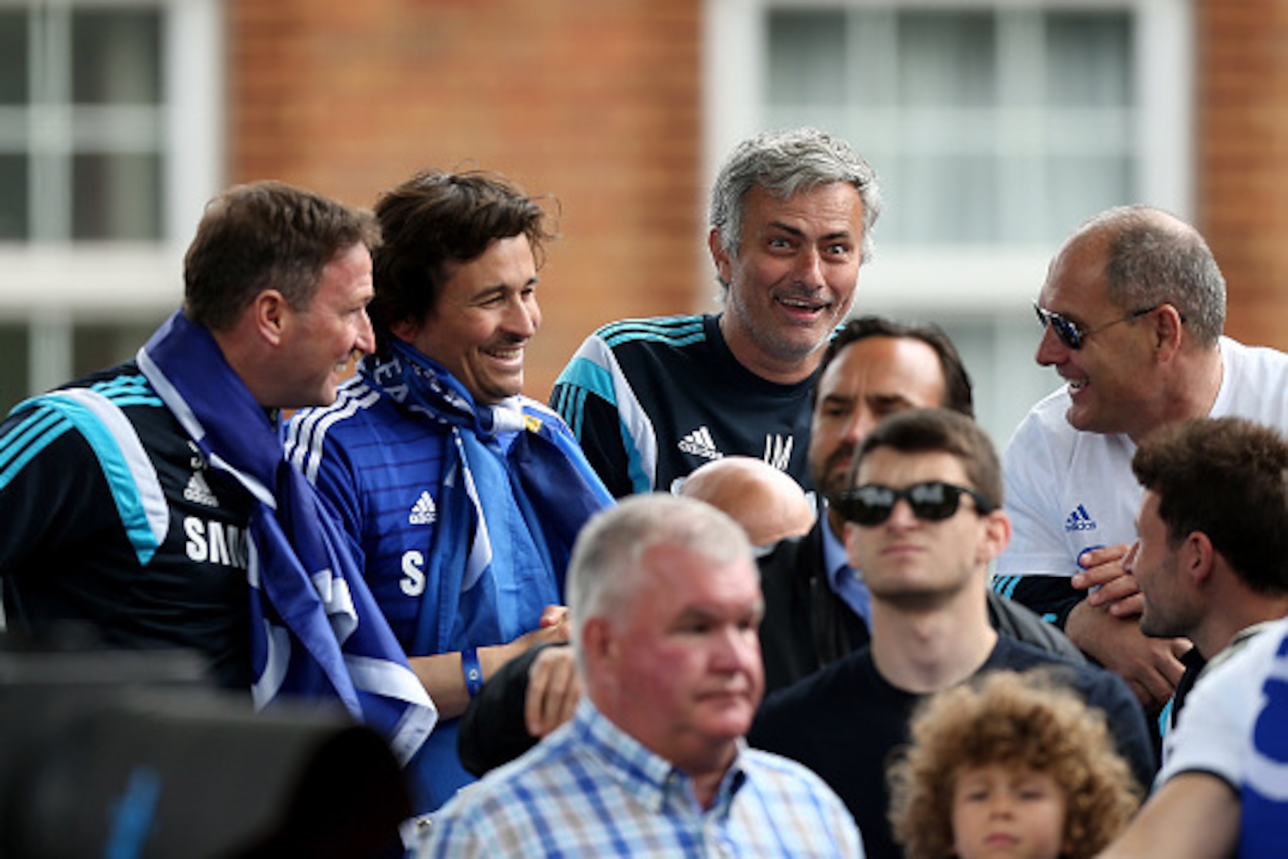 LONDON, ENGLAND - MAY 25:  Chelsea manager Jose Mourinho shares a joke with colleagues duing the Chelsea FC Premier League Victory Parade on May 25, 2015 in London, England.  (Photo by Ben Hoskins/Getty Images)