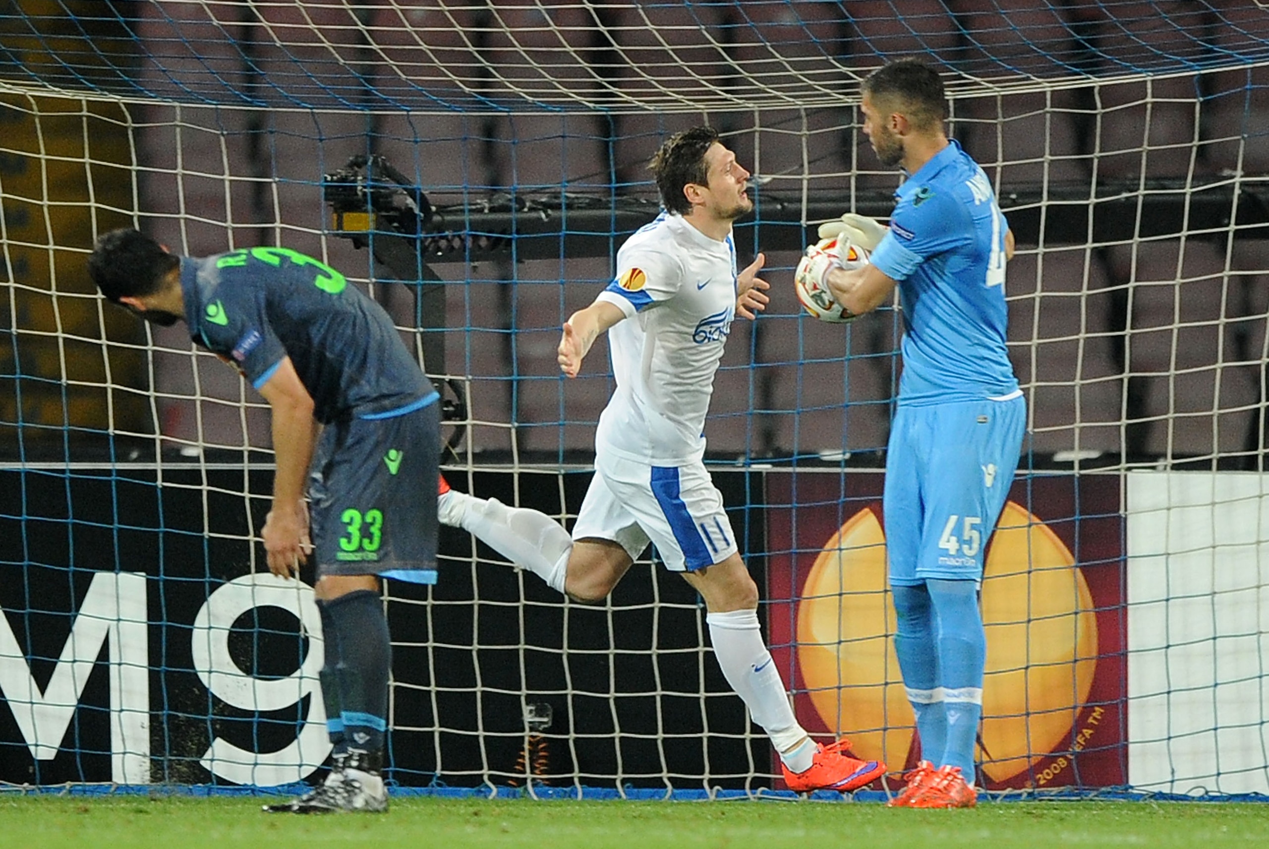 NAPLES, ITALY - MAY 7: Yevhen Seleznyov of Dnipro Dnipropetrovsk celebrates after scoring the equalizing 1-1 goal as Raul Albiol of Napoli shows his dejection during the UEFA Europa League Semi Final between SSC Napoli and FC Dnipro Dnipropetrovsk on May NAPLES, ITALY - MAY 7: Yevhen Seleznyov of Dnipro Dnipropetrovsk celebrates after scoring the equalizing 1-1 goal as Raul Albiol of Napoli shows his dejection during the UEFA Europa League Semi Final between SSC Napoli and FC Dnipro Dnipropetrovsk on May