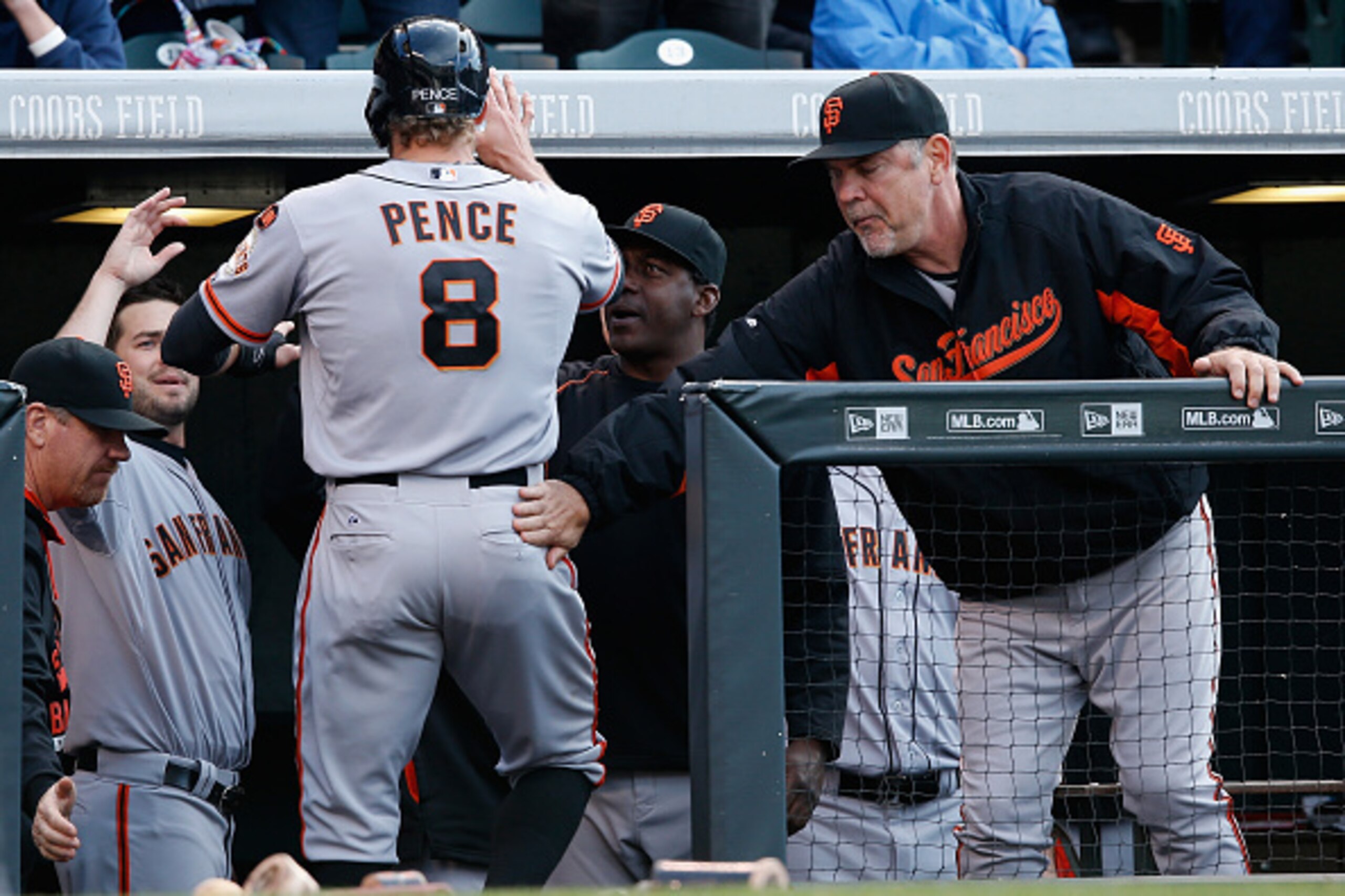 DENVER, CO - MAY 23: Manager Bruce Bochy #15 of the San Francisco Giants welcomes Hunter Pence #8 of the San Francisco Giants to the dugout after scoring on a triple by Brandon Crawford #35 of the San Francisco Giants to take a 7-1 lead against the Color DENVER, CO - MAY 23: Manager Bruce Bochy #15 of the San Francisco Giants welcomes Hunter Pence #8 of the San Francisco Giants to the dugout after scoring on a triple by Brandon Crawford #35 of the San Francisco Giants to take a 7-1 lead against the Color