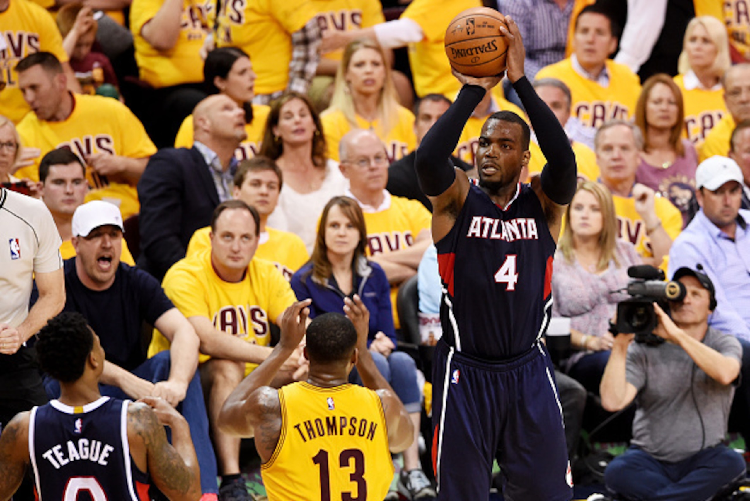 CLEVELAND, OH - MAY 24:  Paul Millsap #4 of the Atlanta Hawks shoots against Tristan Thompson #13 of the Cleveland Cavaliers in the fourth quarter during Game Three of the Eastern Conference Finals of the 2015 NBA Playoffs at Quicken Loans Arena on May 24