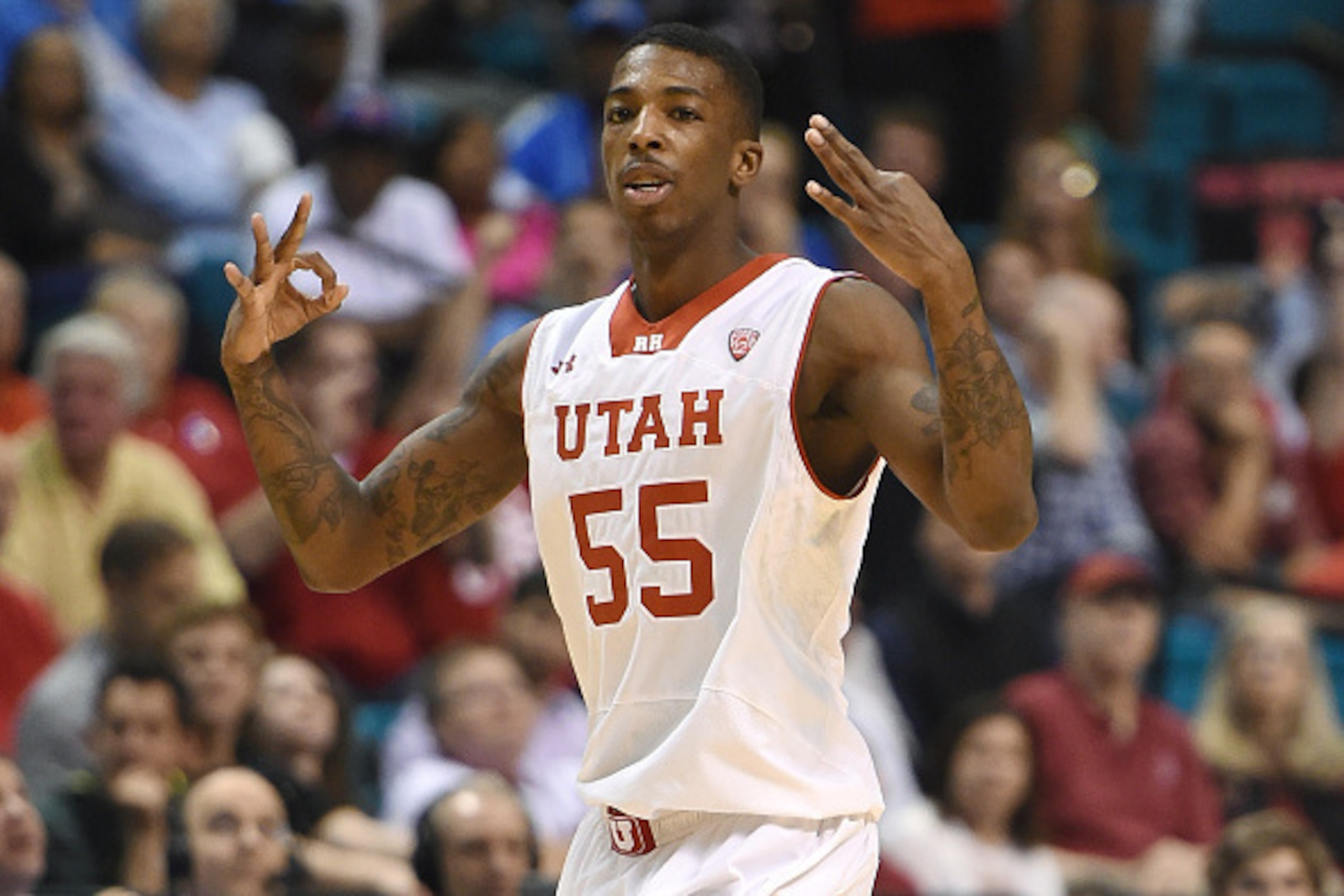 LAS VEGAS, NV - MARCH 12:  Delon Wright #55 of the Utah Utes holds up three fingers on each hand after hitting a 3-pointer against the Stanford Cardinal during a quarterfinal game of the Pac-12 Basketball Tournament at the MGM Grand Garden Arena on March 