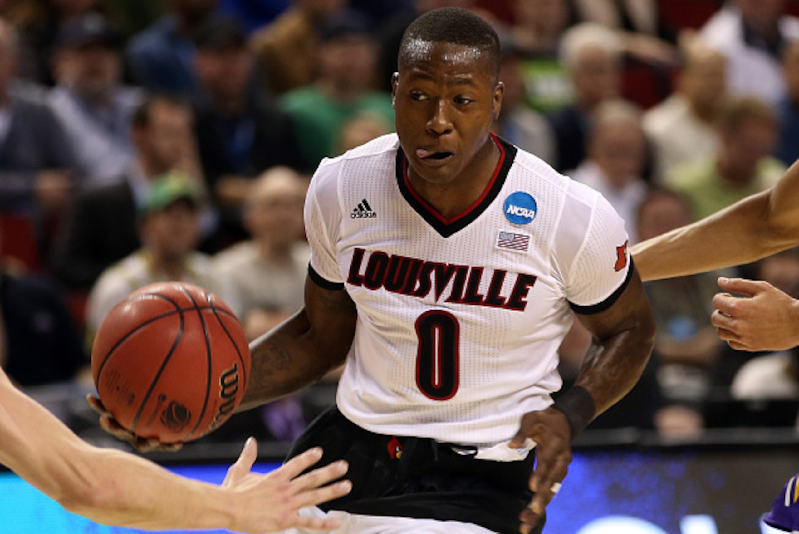 SEATTLE, WA - MARCH 22:  Terry Rozier #0 of the Louisville Cardinals drives to the basket against the Northern Iowa Panthers in the first half of the game during the third round of the 2015 NCAA Men's Basketball Tournament at KeyArena on March 22, 2015 in