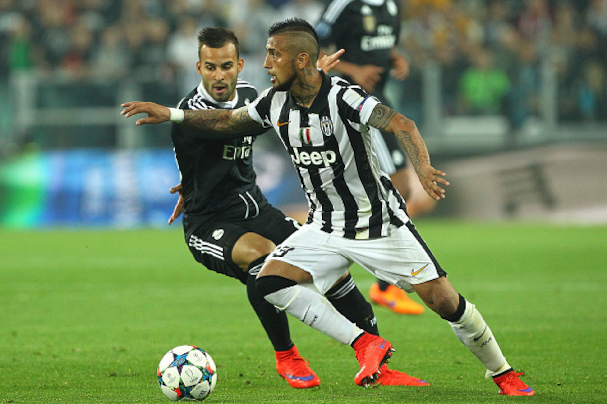TURIN, ITALY - MAY 05:  Arturo Vidal (R) of Juventus FC competes for the ball with Jose (L) of Real Madrid CF during the UEFA Champions League semi final match between Juventus and Real Madrid CF at Juventus Arena on May 5, 2015 in Turin, Italy.  (Photo b